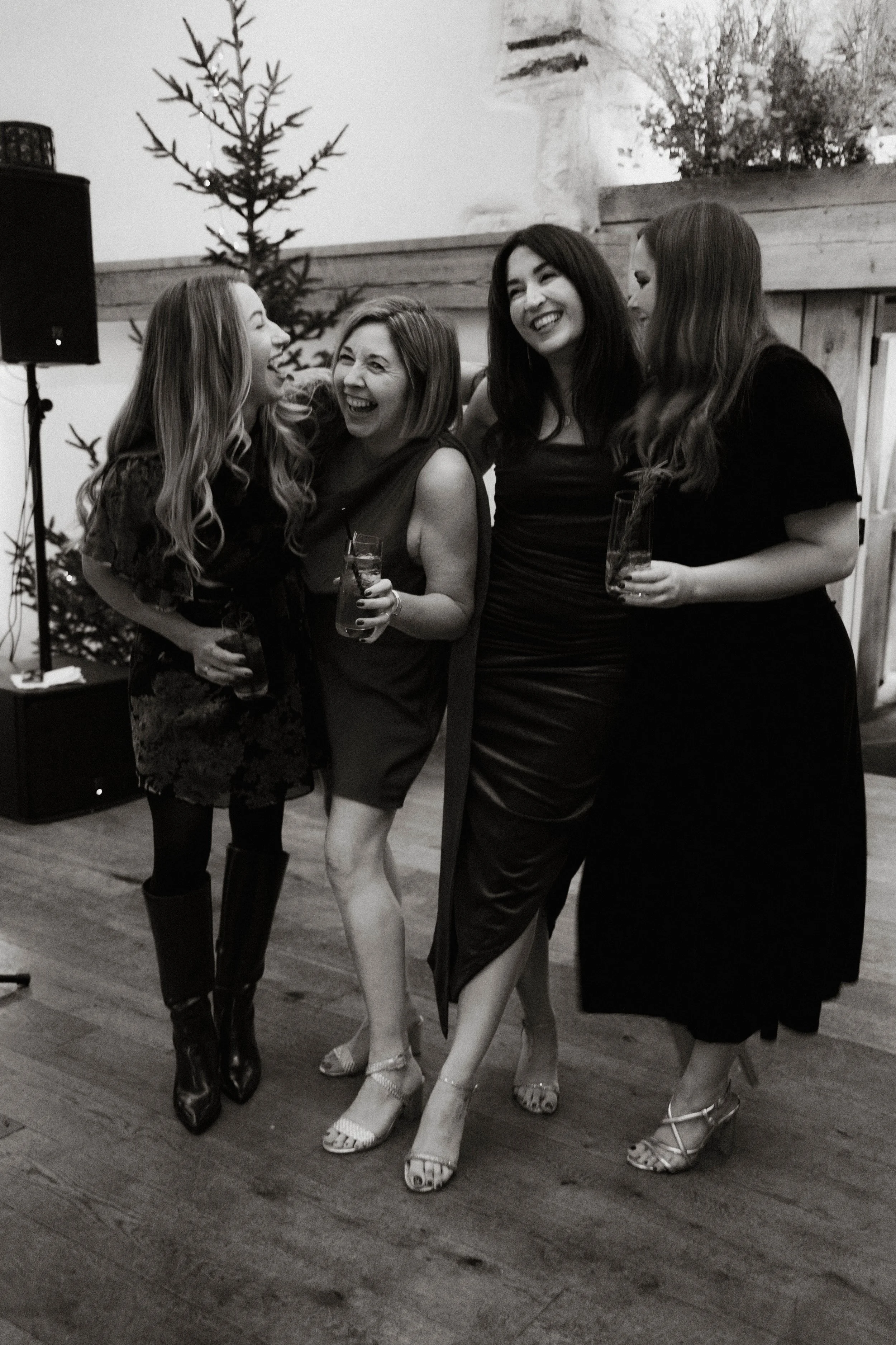 Friends at a Christmas celebration at Oxleaze Barn, Cotswolds