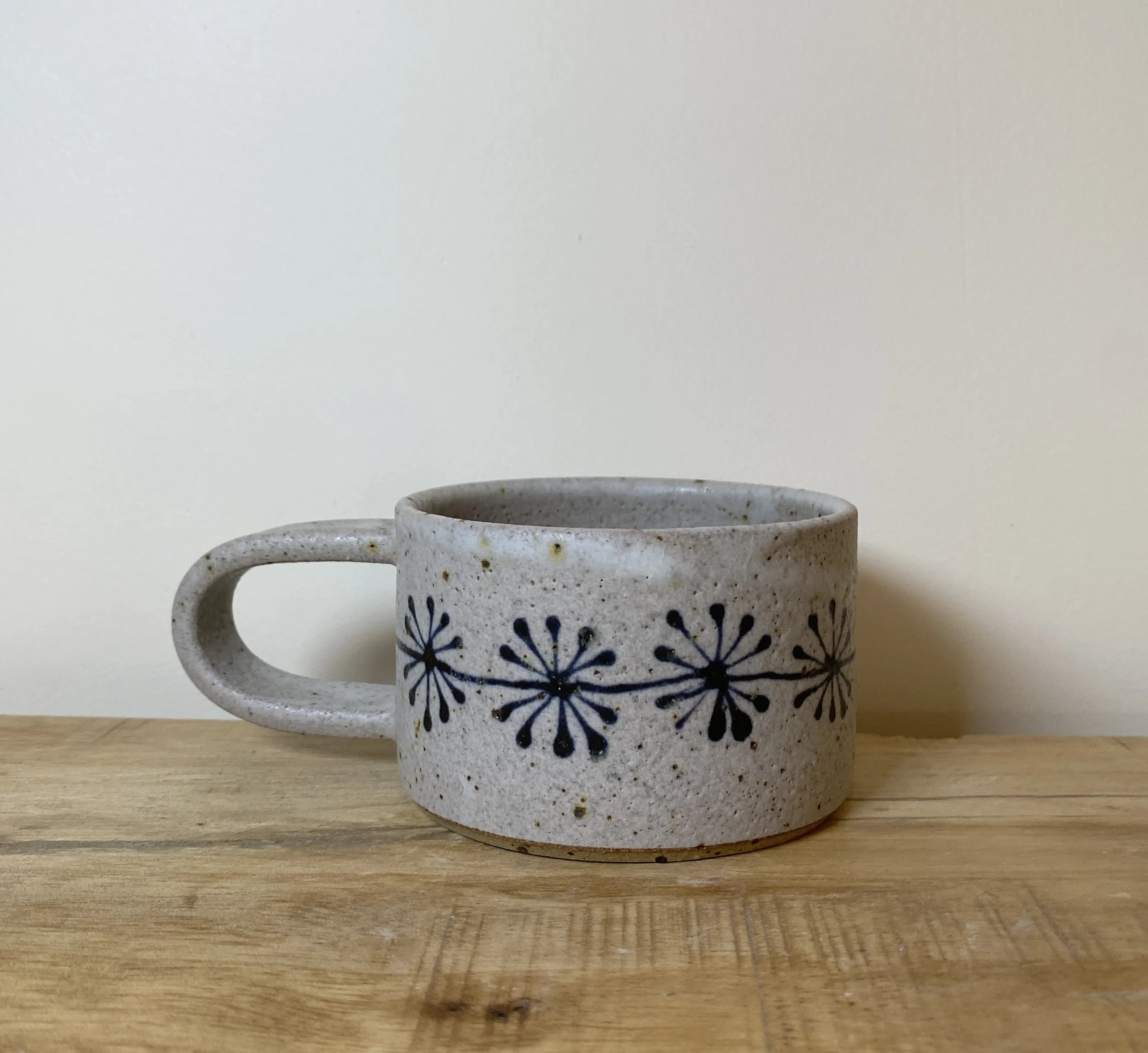 Small cup with fossil-inspired design