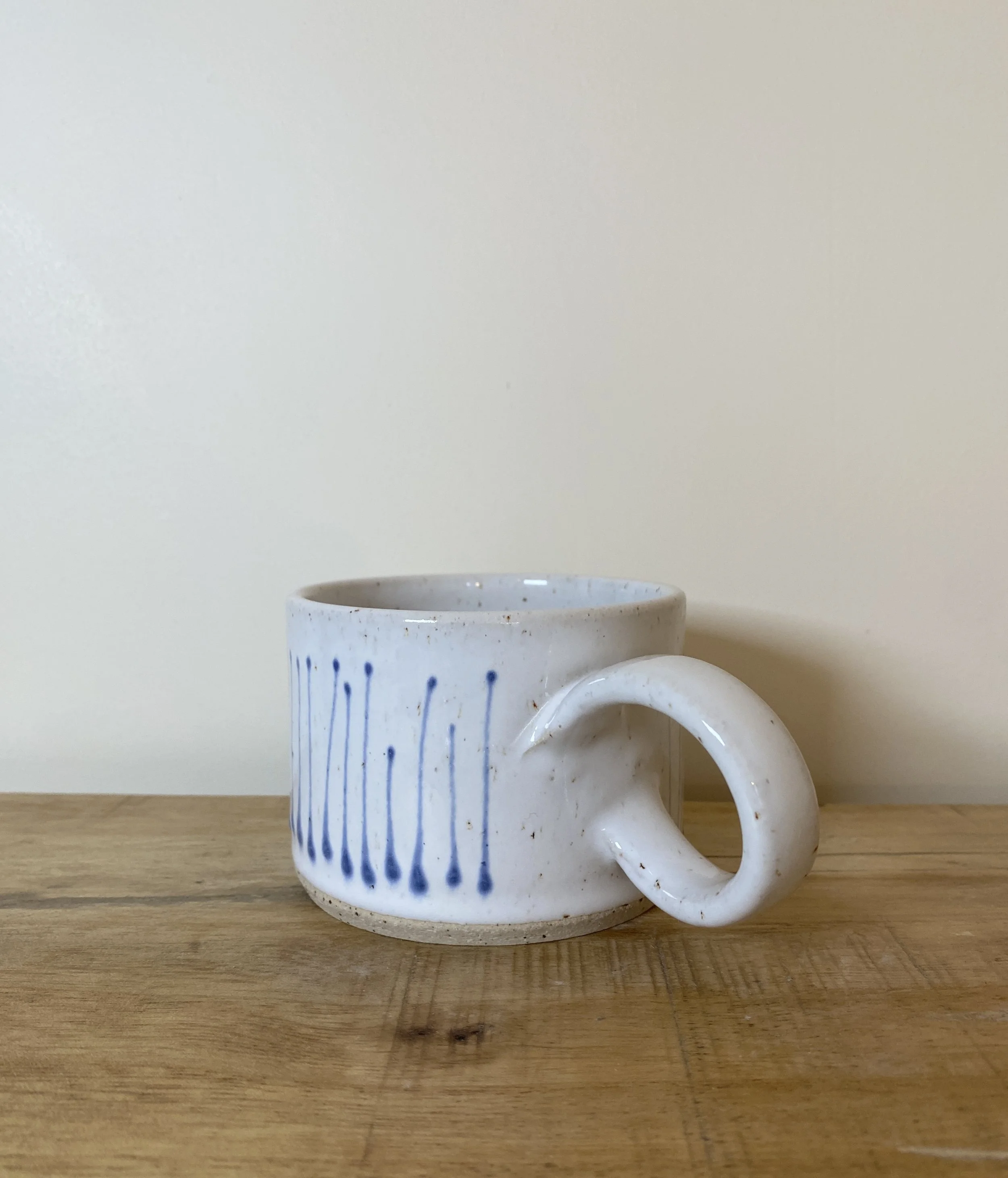 White quirky handle cup