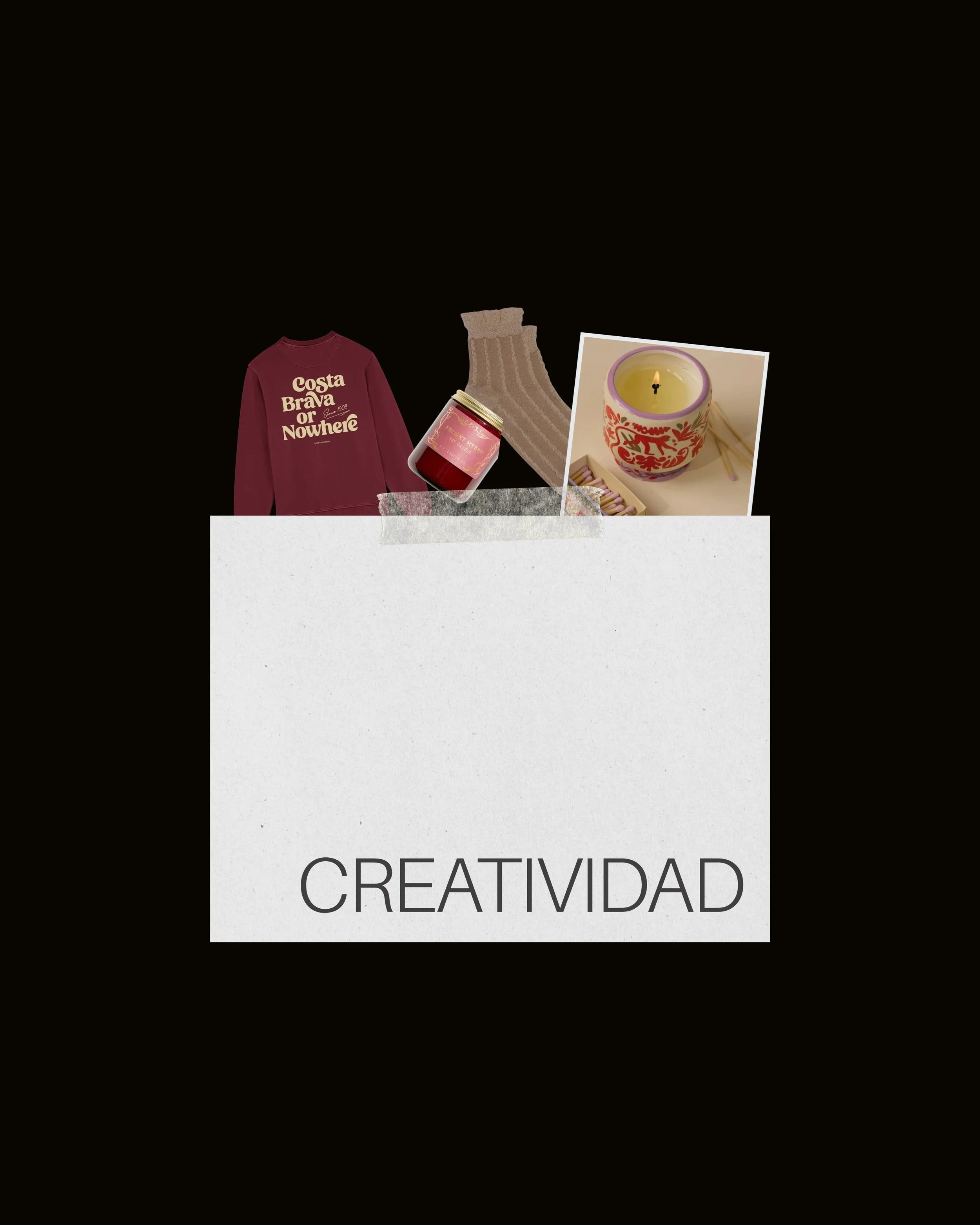 Una caja blanca con la palabra 'CREATIVIDAD' en la parte inferior, con objetos creativos en la parte superior incluyendo una sudadera, una vela, un frasco de gel y una fotografía de una vela decorativa. 