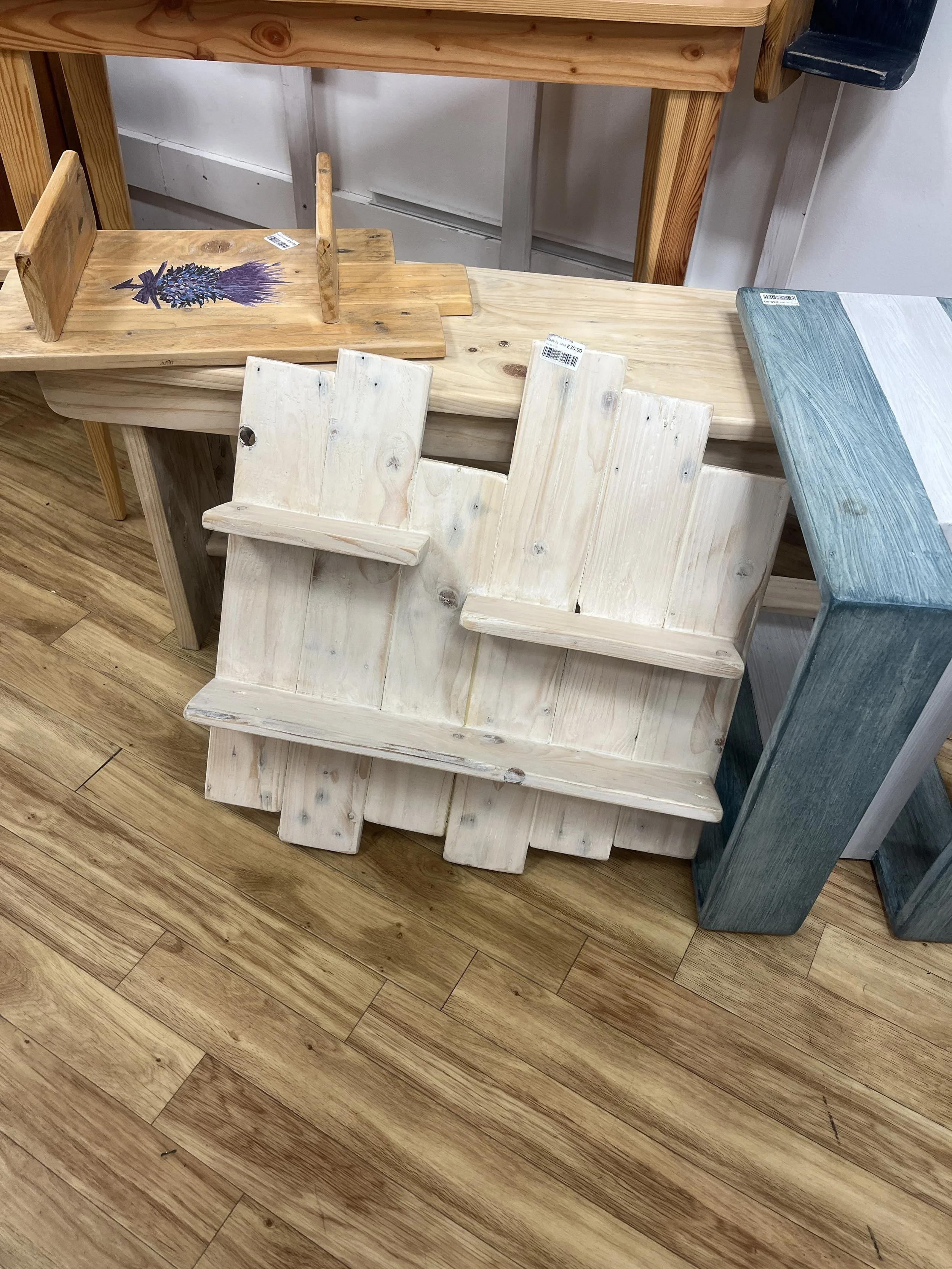 small wall shelving unit made from pallet wood