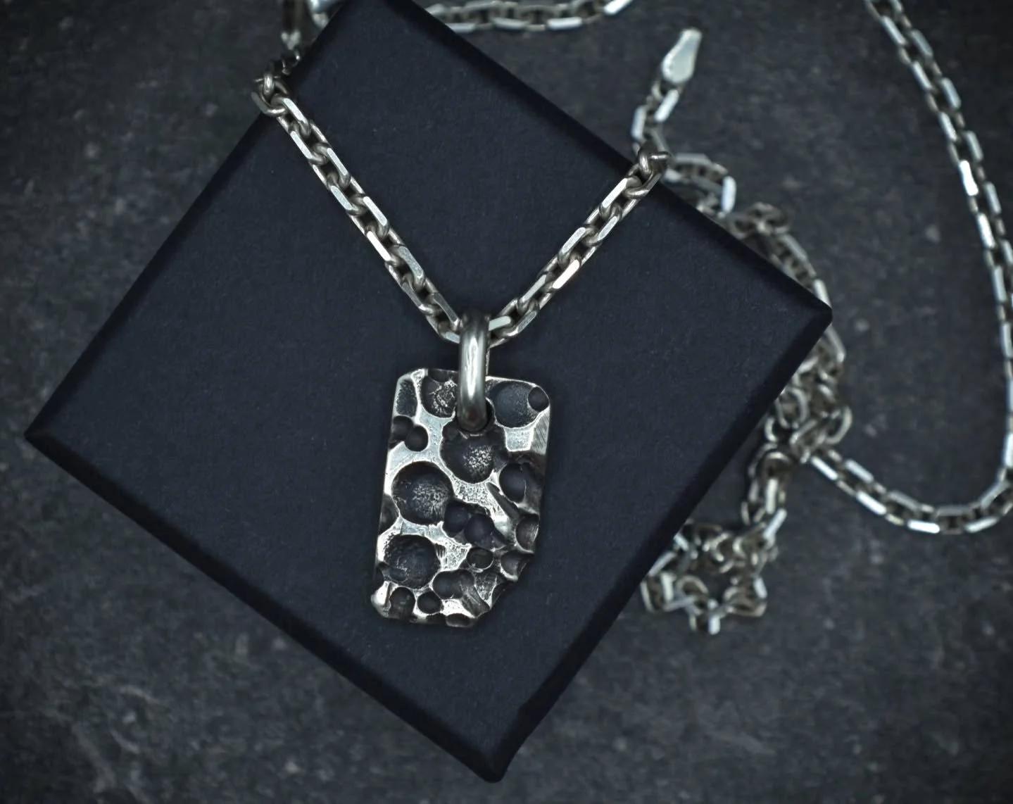 Always shifting. Evolving. Shaping the world around it.

The Volcanic Slab pendant. Individually carved into solid silver.