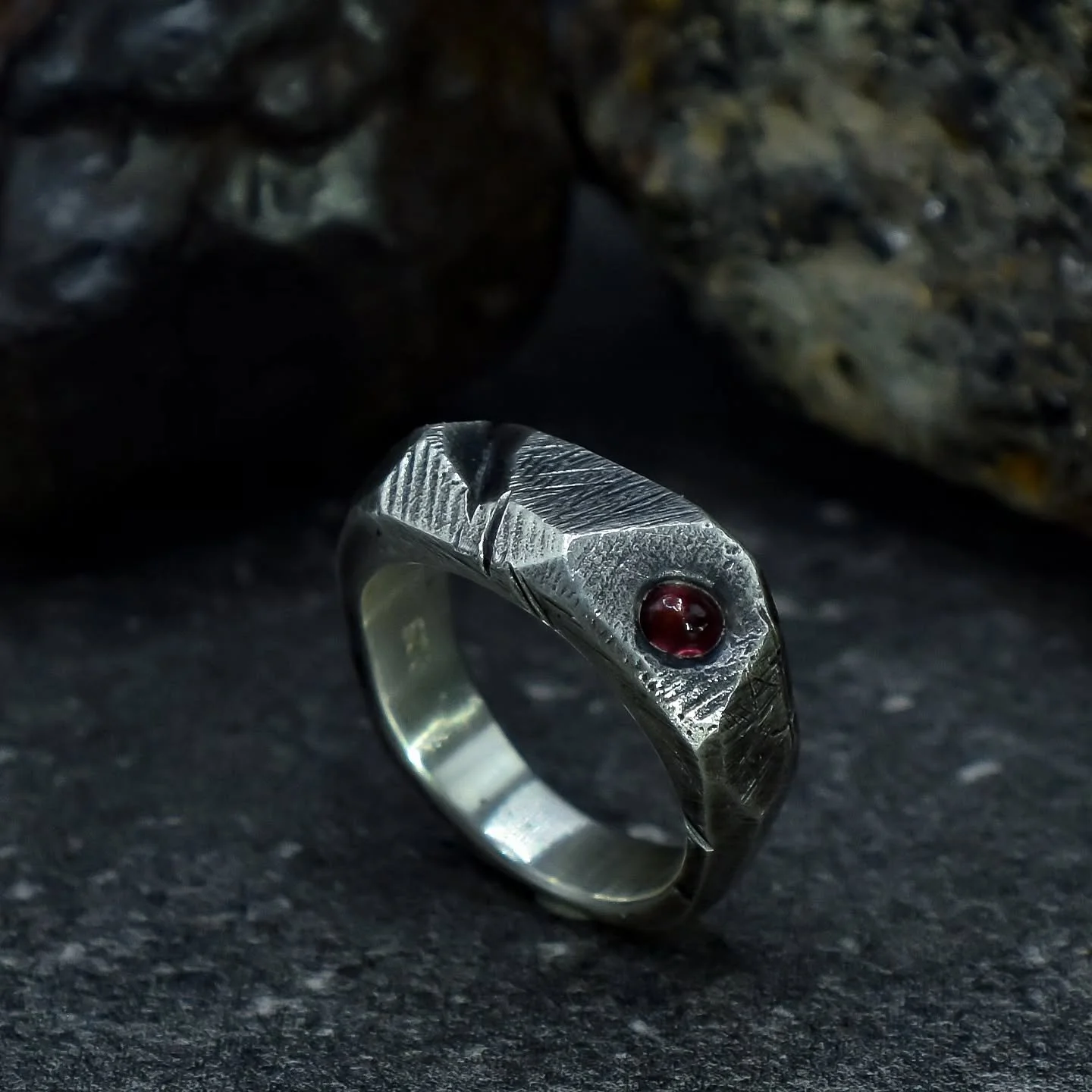 Kaos series - solid silver ring, feat. Tanzanian sapphire cast in place and off-set to the face.

The thing I love about this series of rings, is that when I sit down to create one, I have absolutely no idea how it's going to look when it's finished.