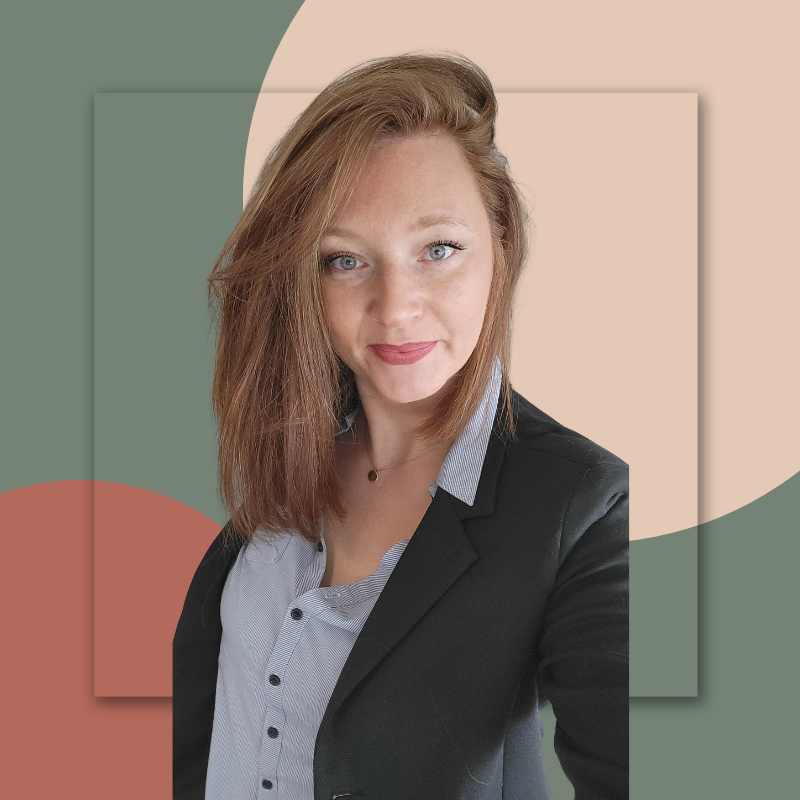 A woman with shoulder-length brown hair, light skin, and blue eyes wearing a black blazer over a light blue button-up shirt, posing for a photo with a stylized geometric background.