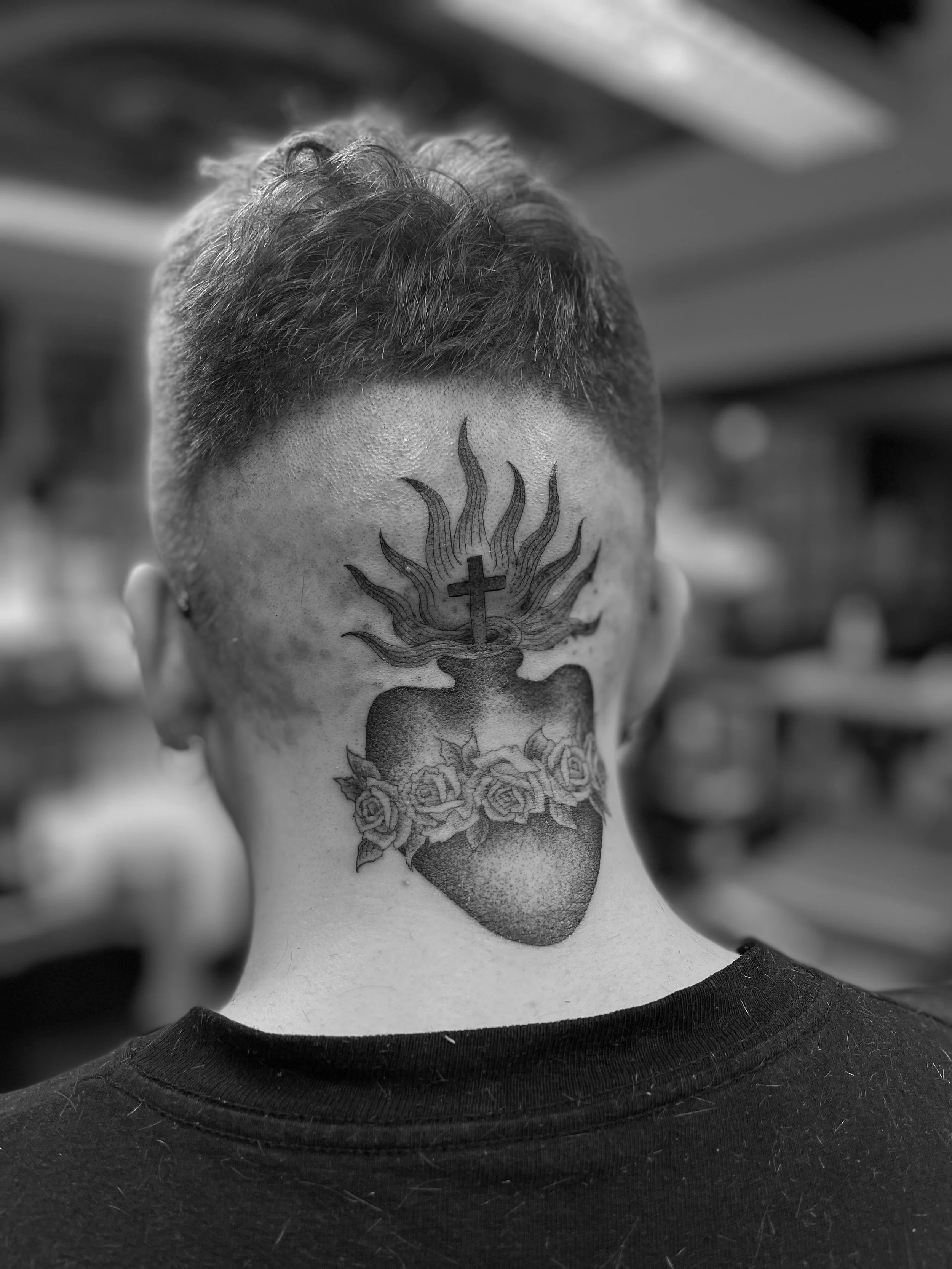 Fine line, black and grey, sacred heart tattoo on the head, done at Frith Street Tattoos, Soho, central London.
