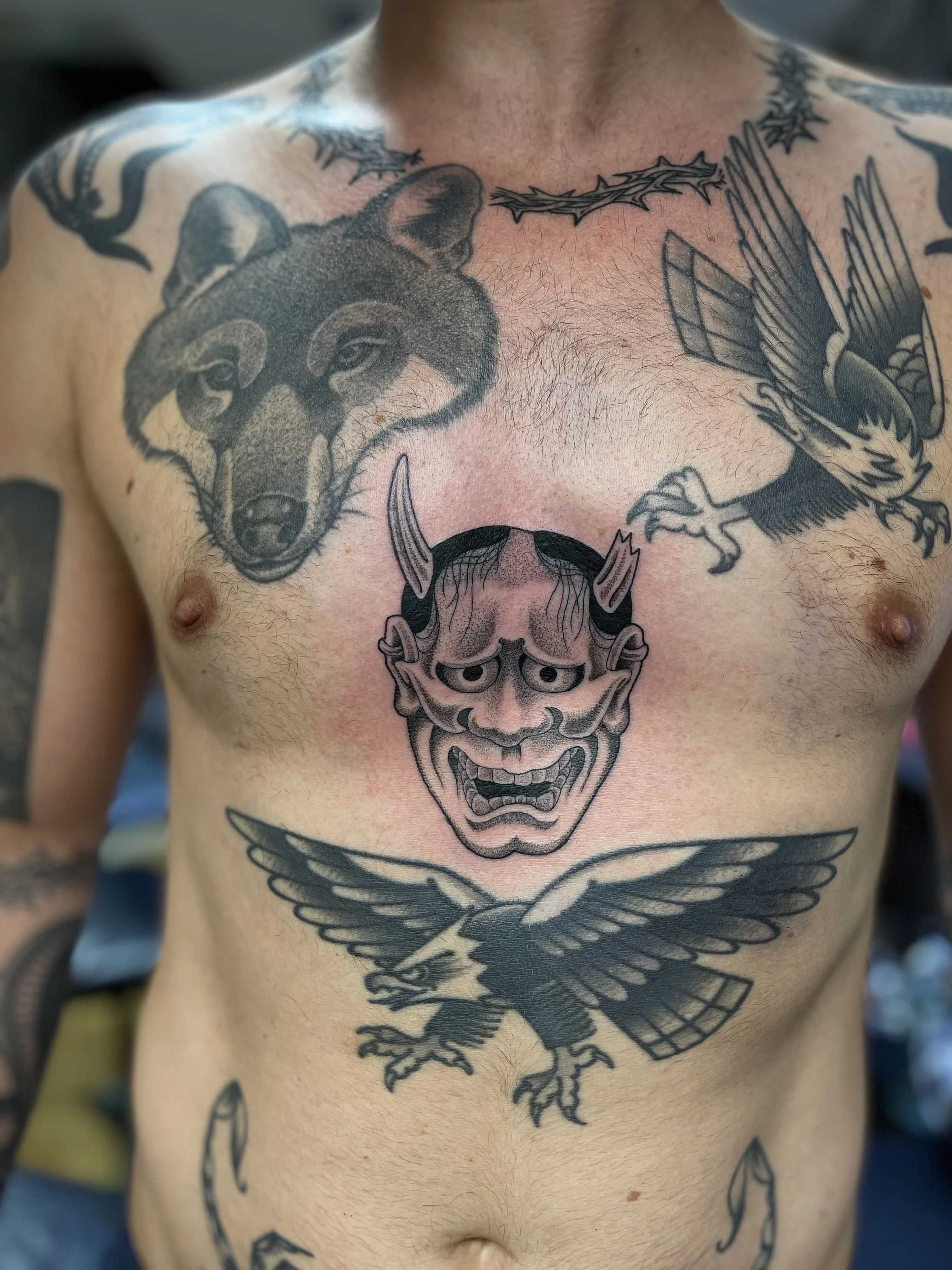 Fine line hannya tattoo on the belly, done at Frith Street Tattoos, Soho, central London.