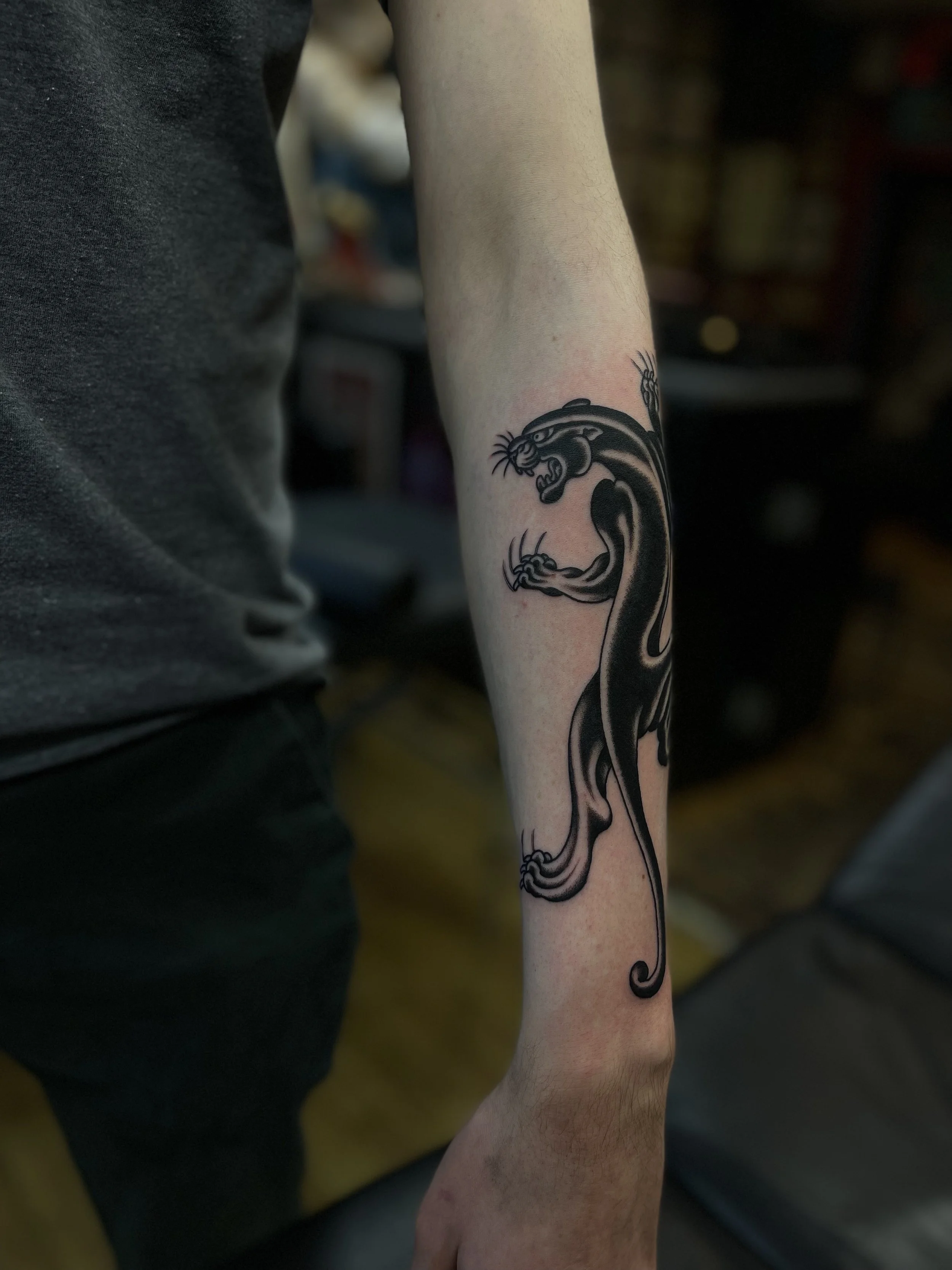 Traditional panther tattoo, done at Frith Street Tattoos, Soho, central London.