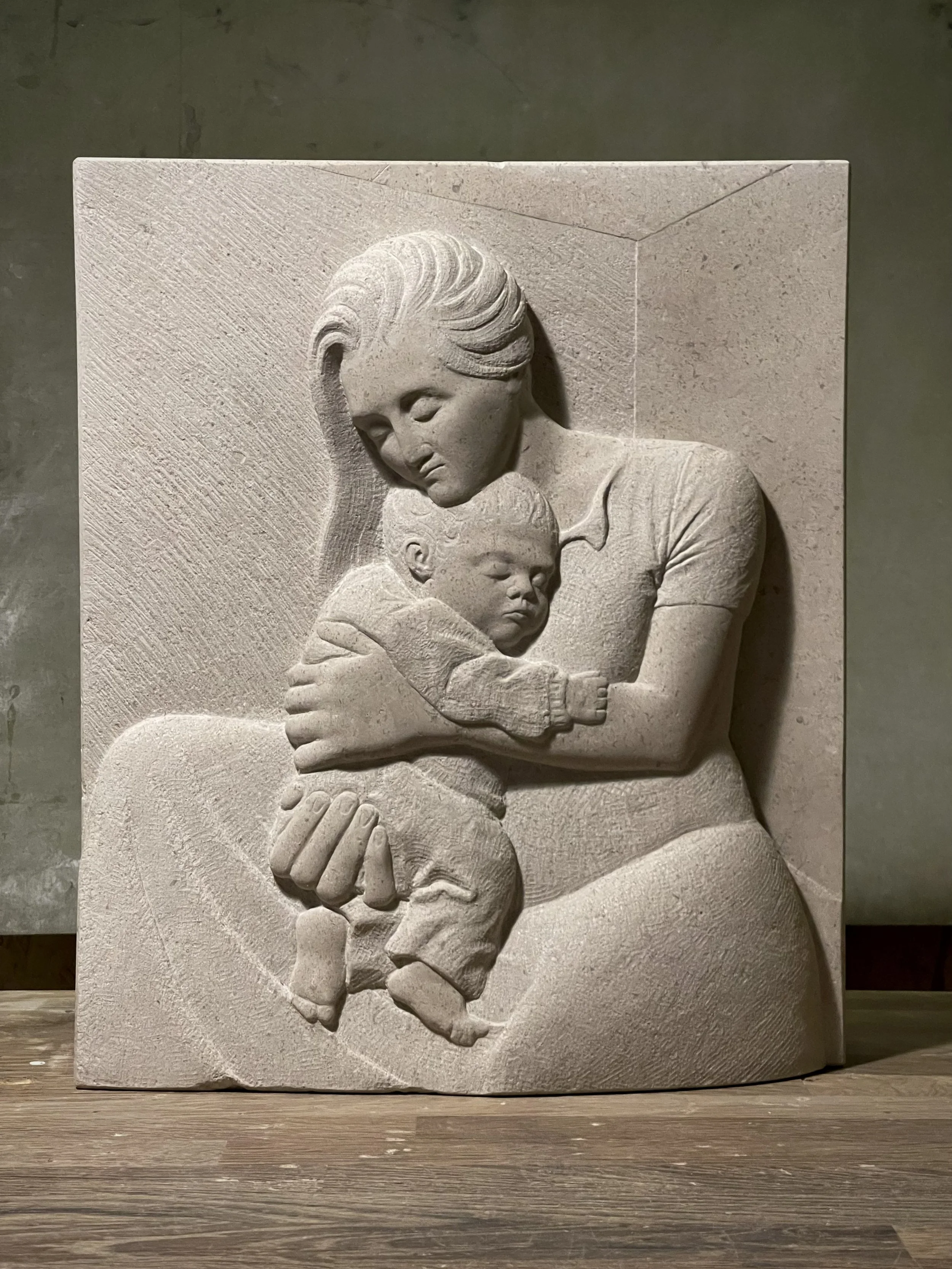 Stone carving in Hopton Wood stone, of a mother and child. Carved in south London.