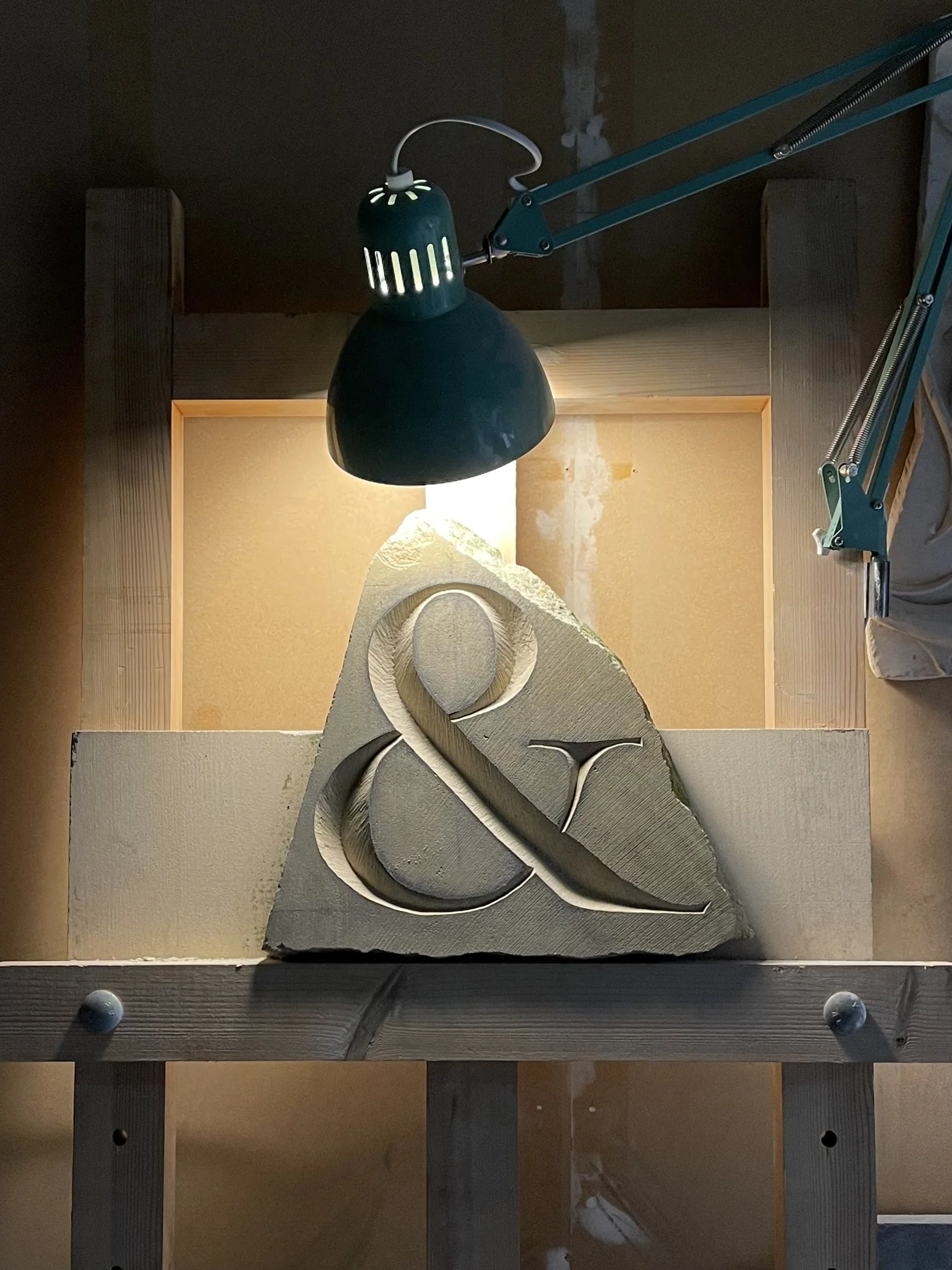 Stone carving of an ampersand in Caen limestone.