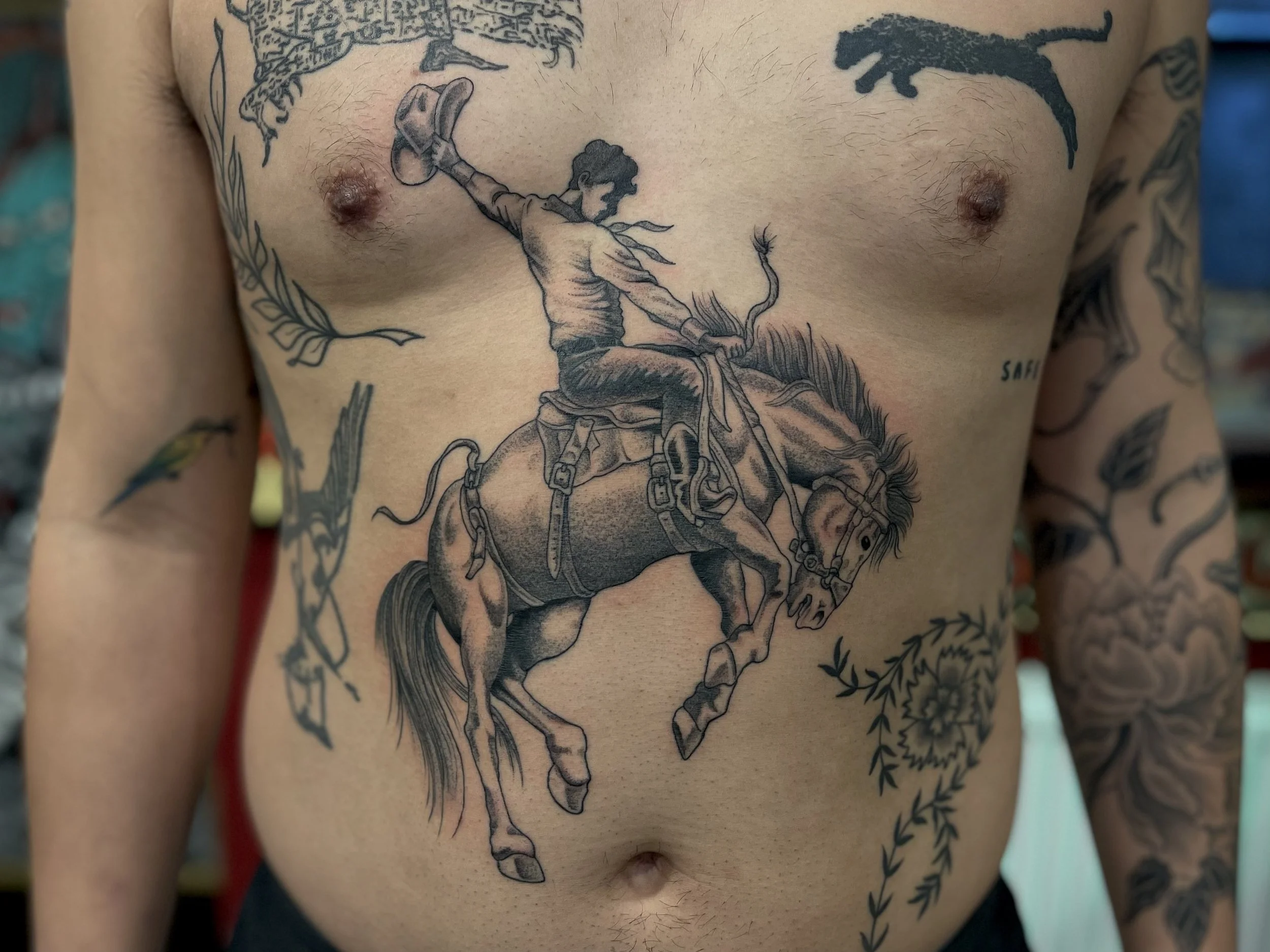 Fine line black and grey cowboy and horse tattoo done in Soho, central London.