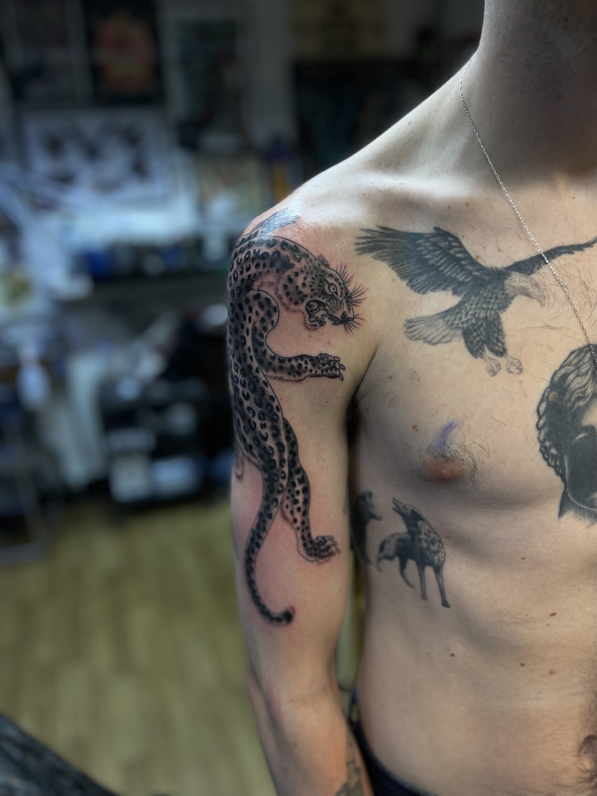 Fine line leopard tattoo on the shoulder done at Frith Street Tattoos, soho, central London.