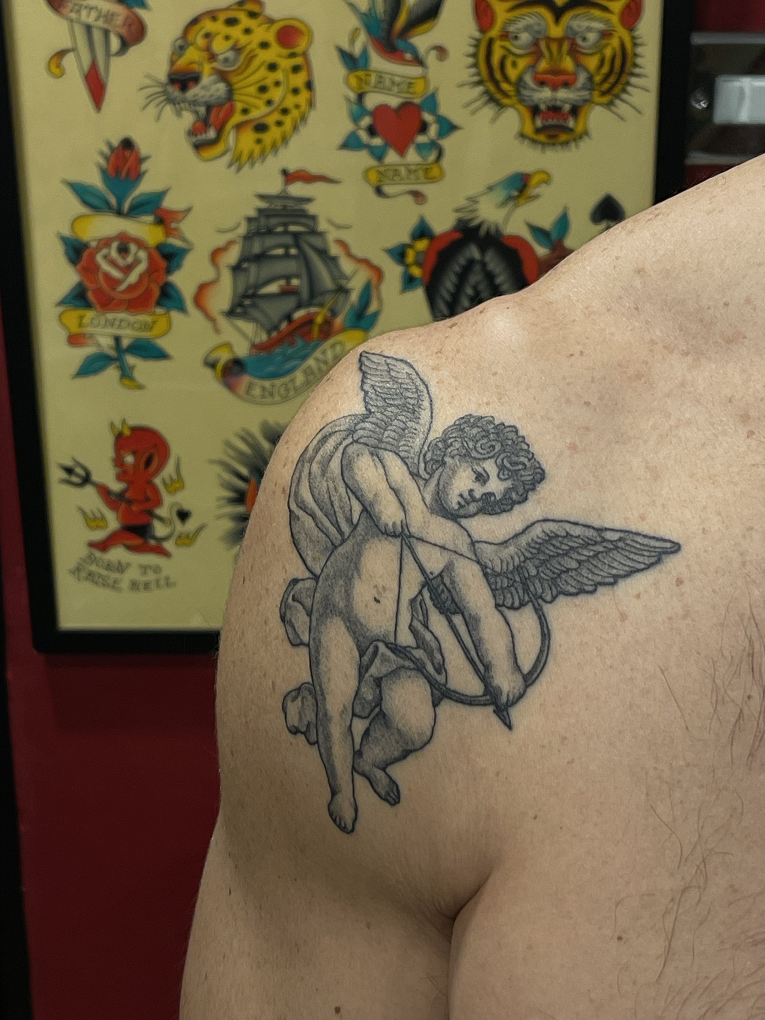 Healed cherub tattoo, done at Frith Street Tattoos, Soho, central London.