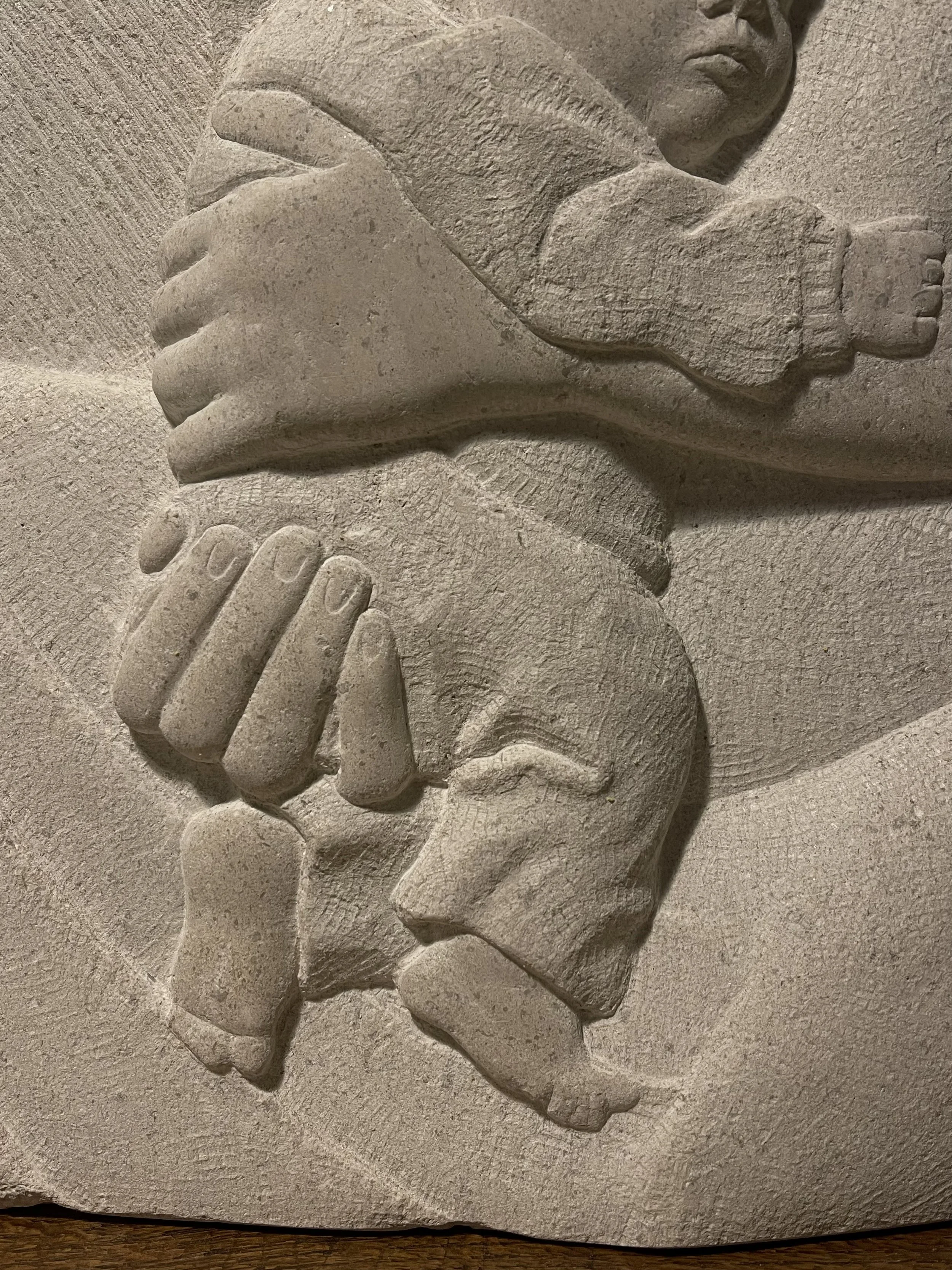 Stone carving in Hopton Wood stone, of a mother and child. Carved in south London.
