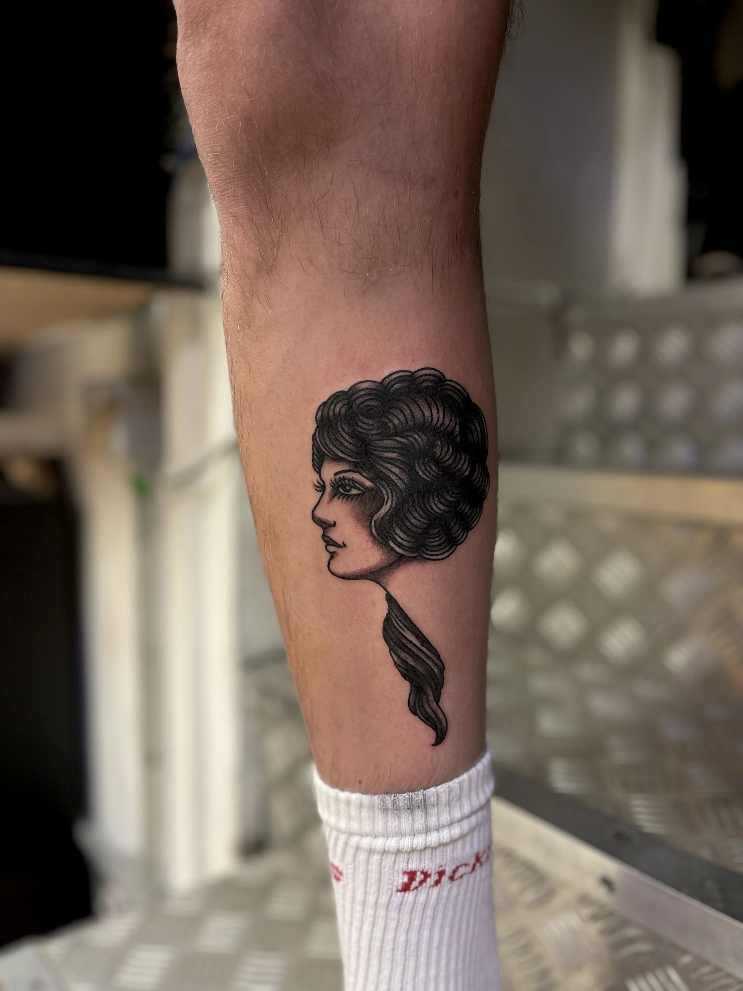 Traditional girl head tattoo, done at Frith Street Tattoos, Soho, central London.