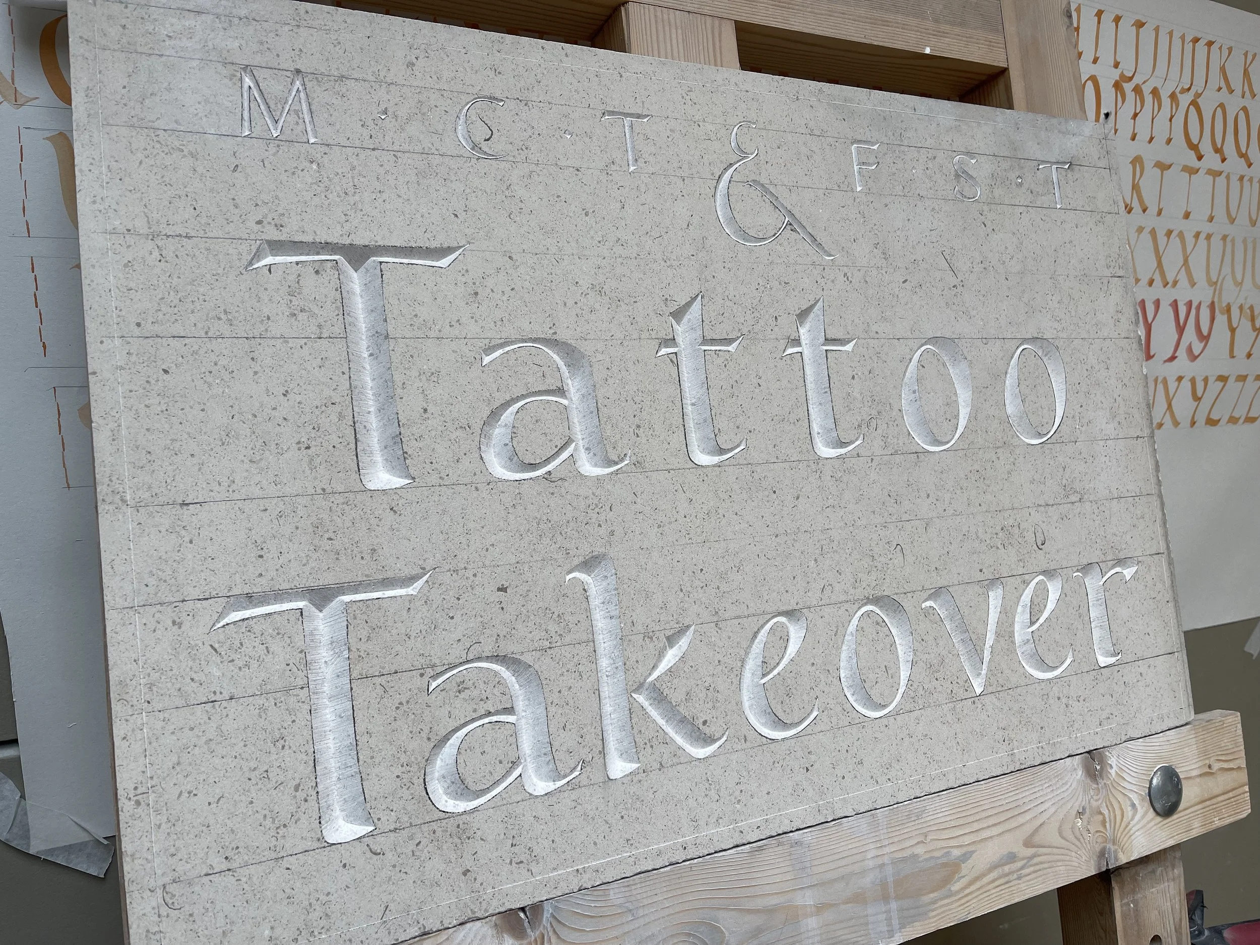Stone carved sign for Tattoo Takeover 2023. 