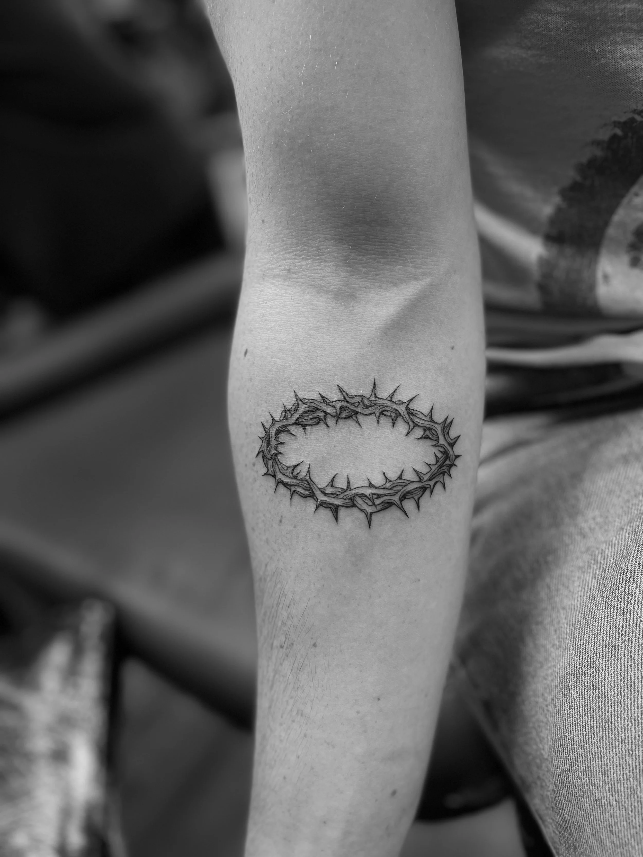 Fine line crown of thorns tattoo done in Soho, central London.