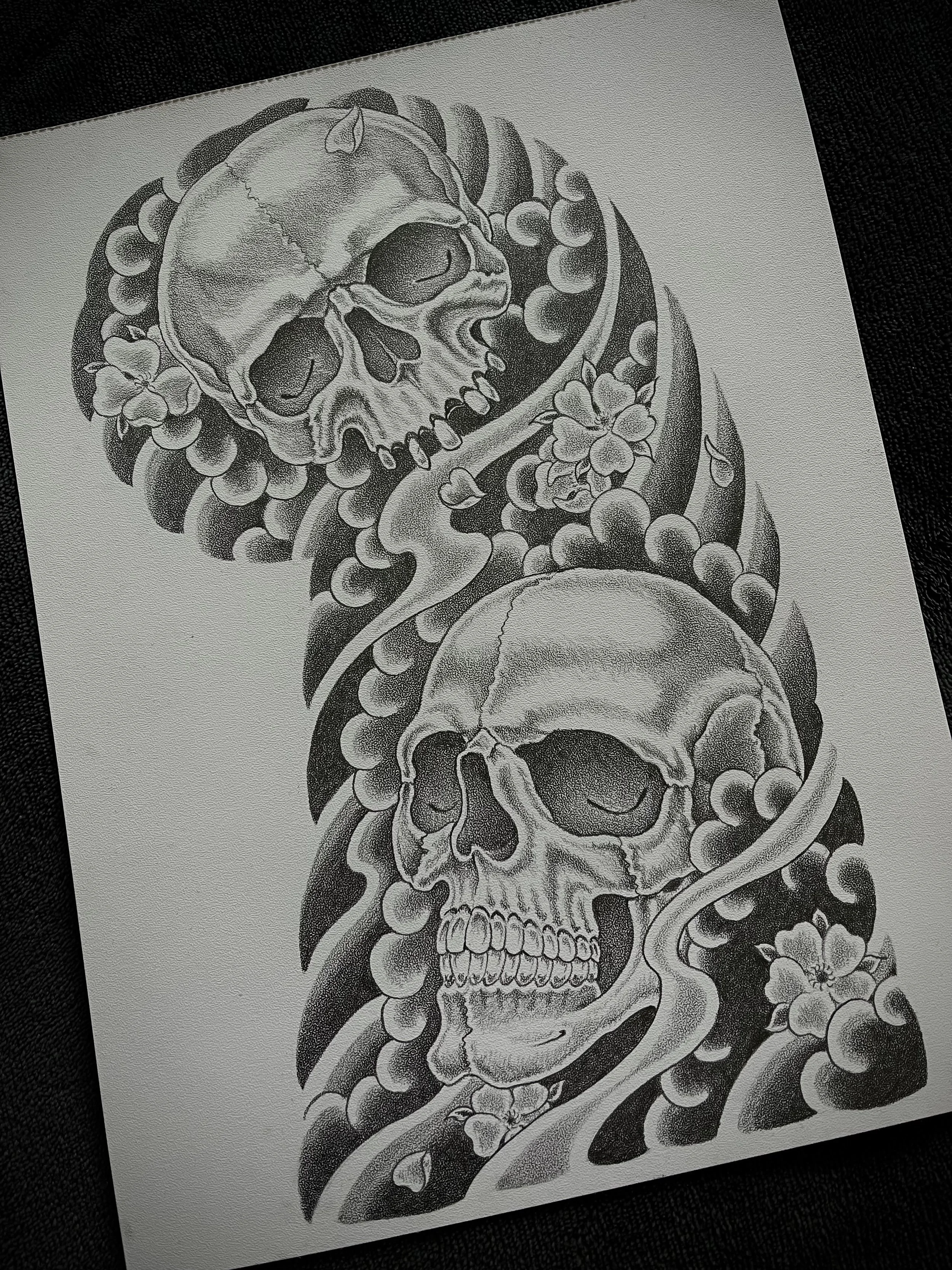 Fine line Japanese skull and cherry blossom half sleeve tattoo design, left arm.