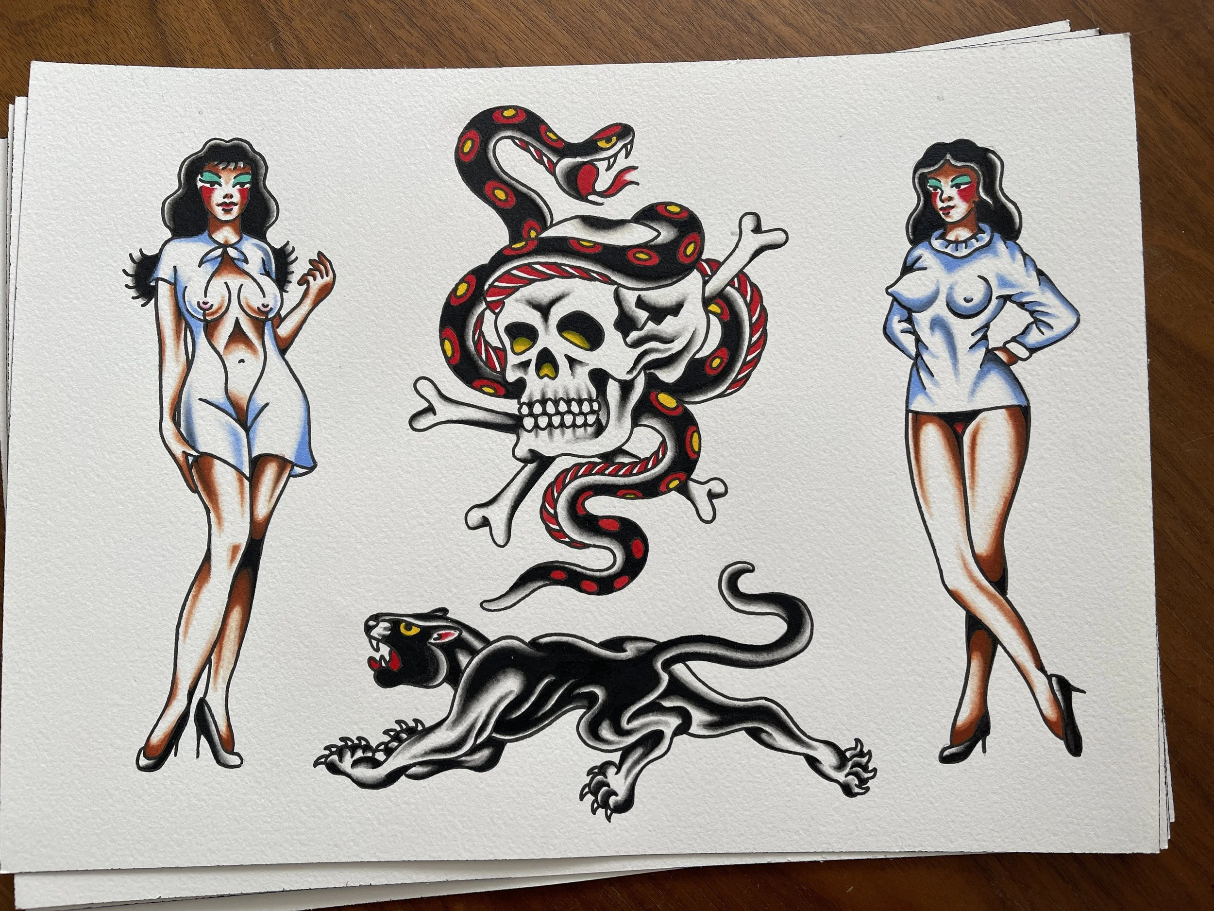 Traditional tattoo flash sheet of girls, skull, snake and panther, designs available to be tattooed at Frith Street Tattoos, Soho, London