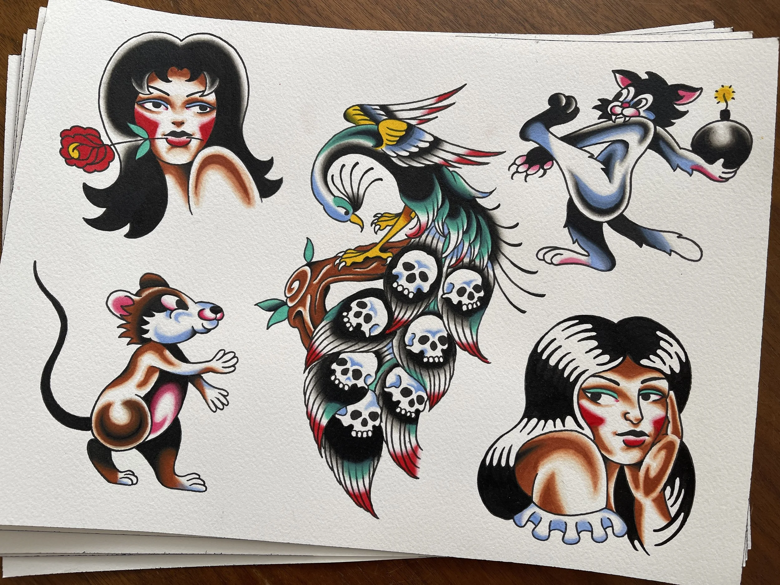 Traditional tattoo flash sheet of girls, mouse, cat and peacock, designs available to be tattooed at Frith Street Tattoos, Soho, London