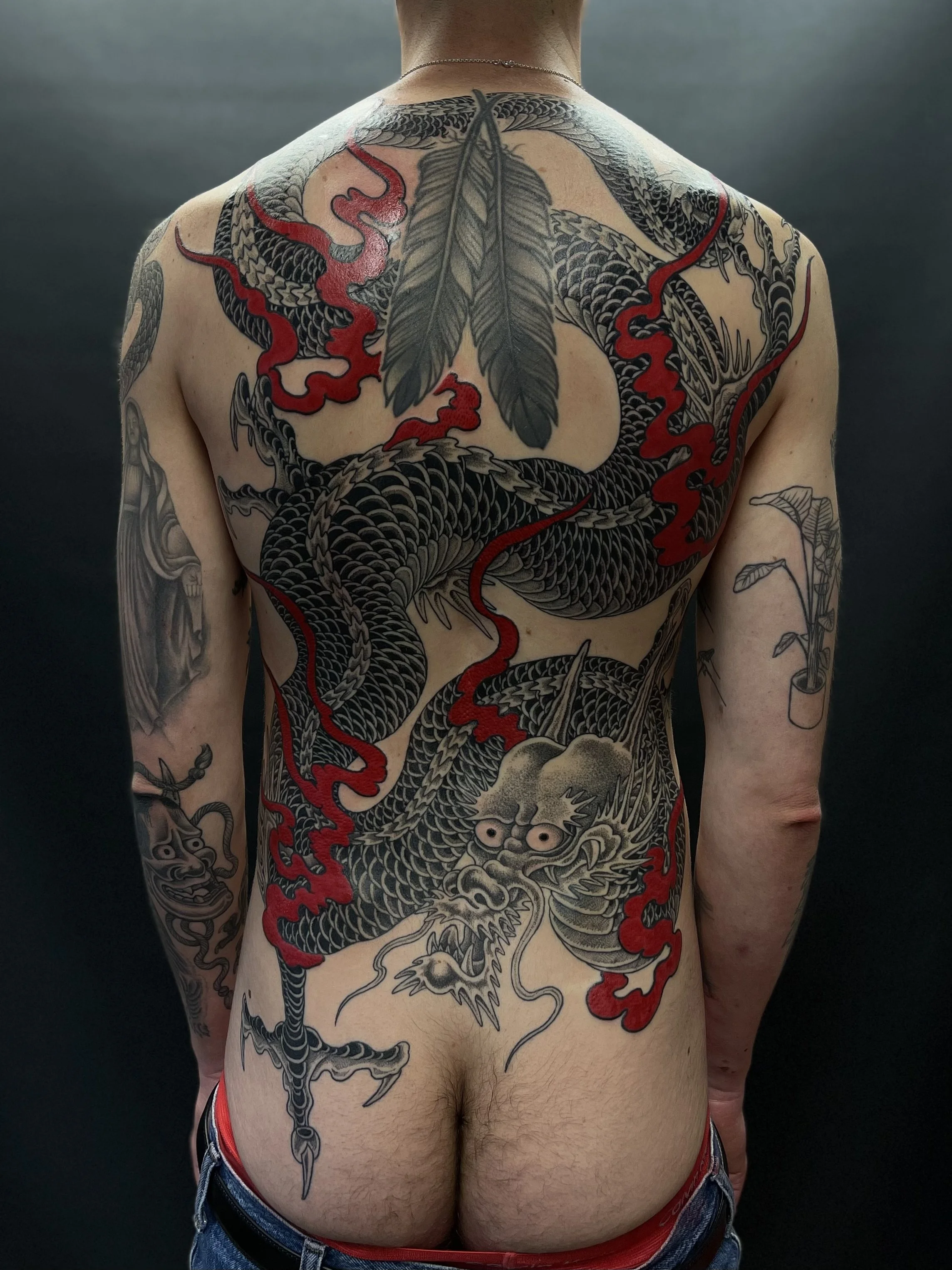 Fine line Japanese dragon backpiece, done at Frith Street Tattoos, Soho, central London.