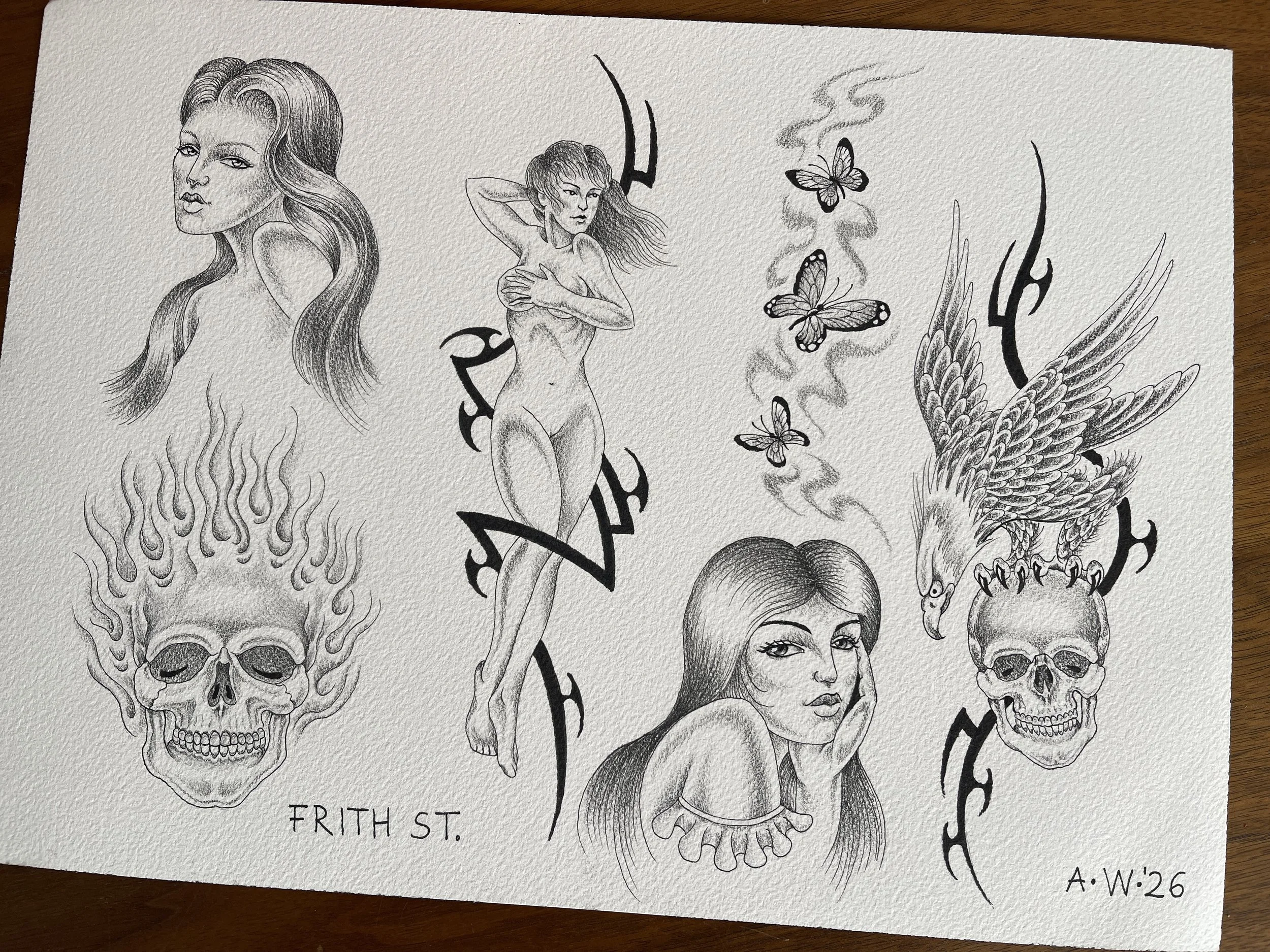 Flash sheet of fine line tattoo designs with skulls, girls, eagles, tribal and butterflies