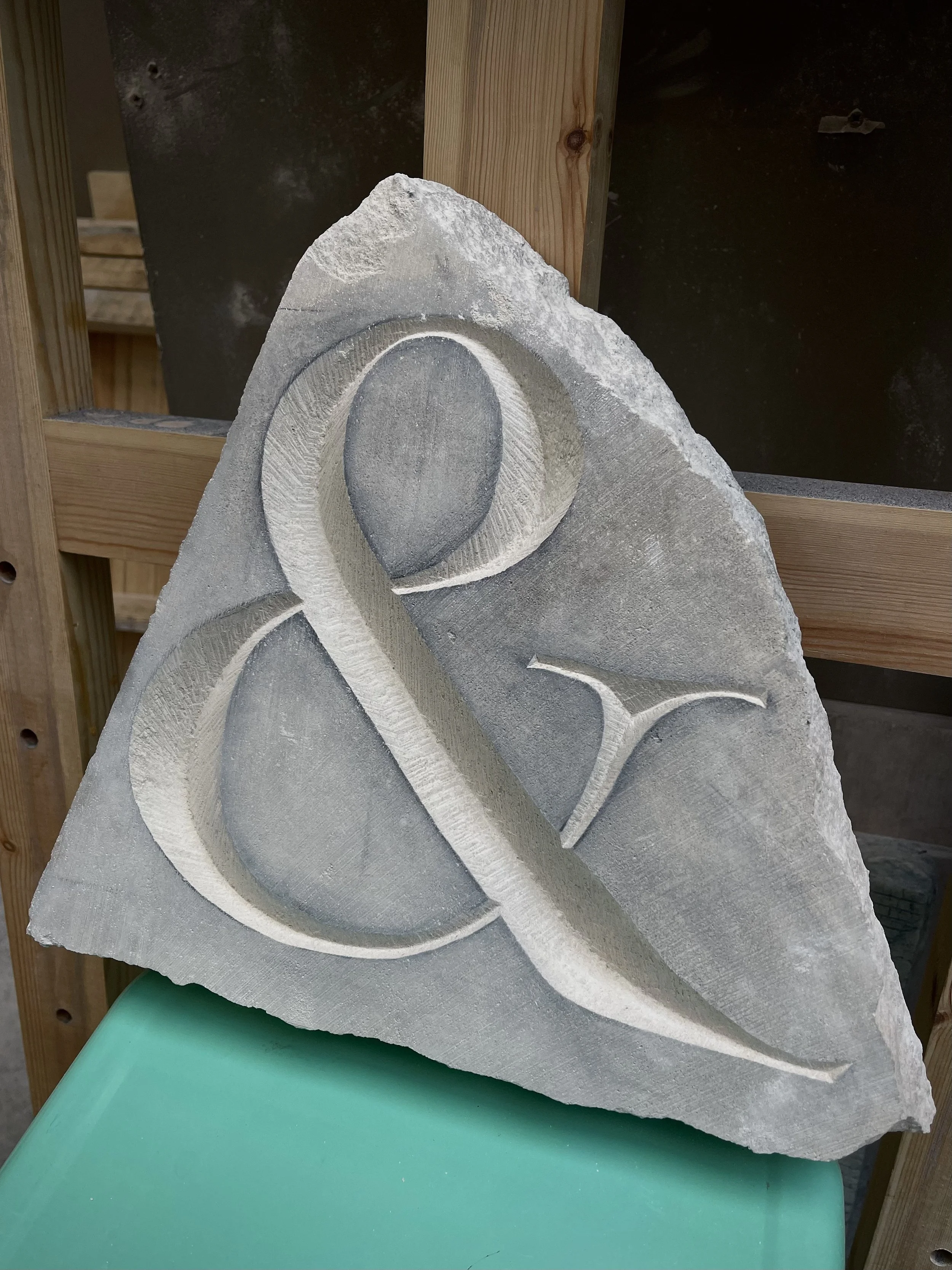 Stone carving of an ampersand in Caen limestone.