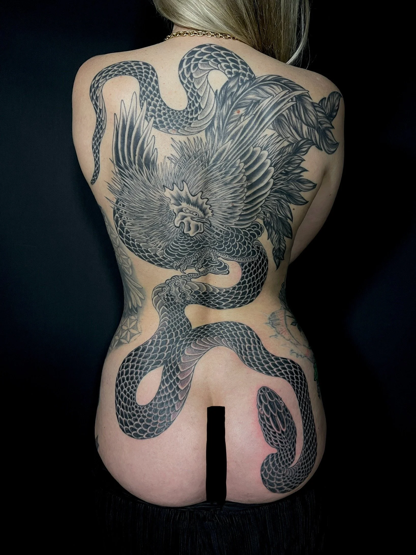 Fine line Japanese snake and cockerel backpiece, done at Frith Street Tattoos, Soho, central London.