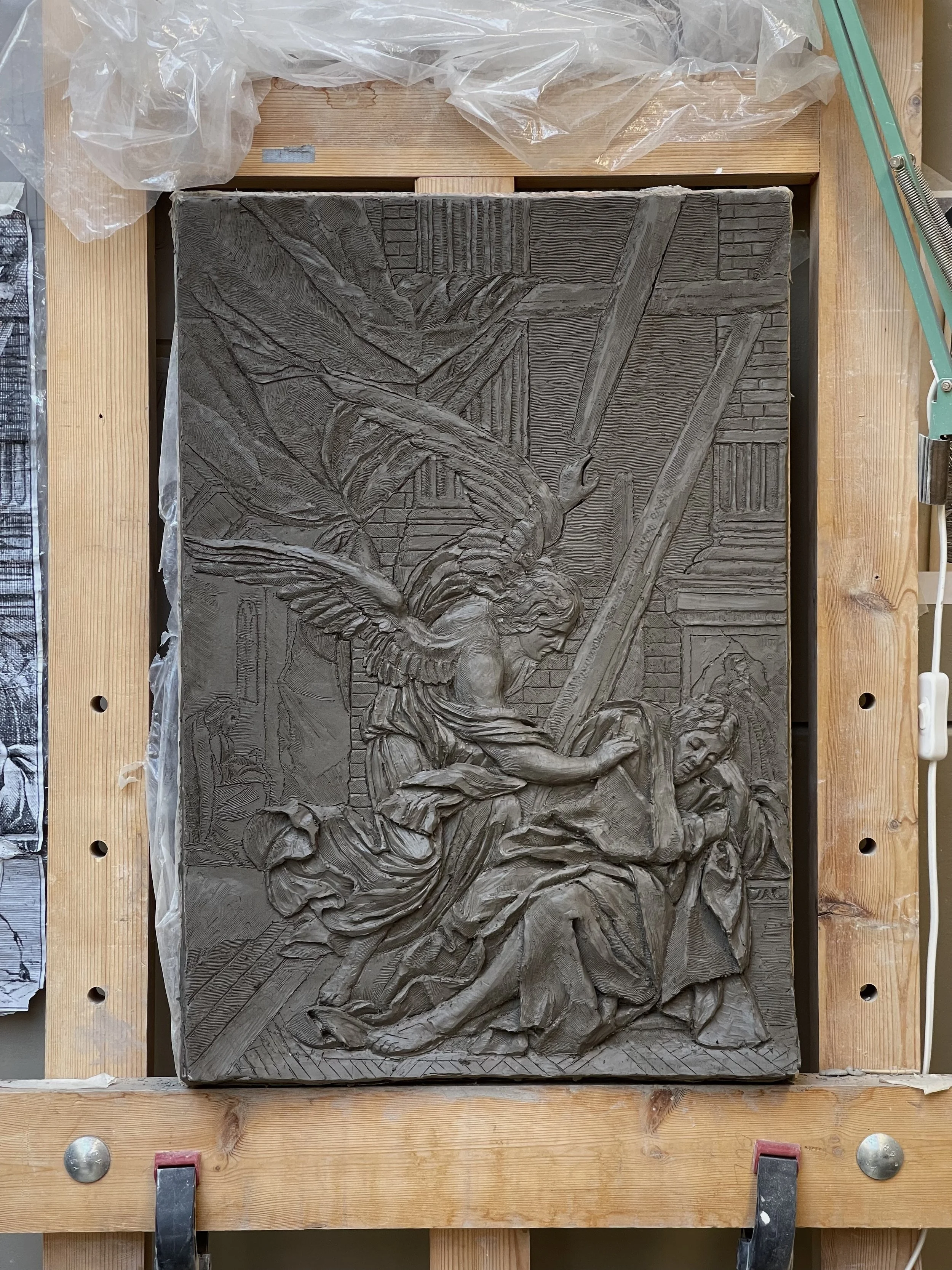 Clay model for scaled up relief carving.