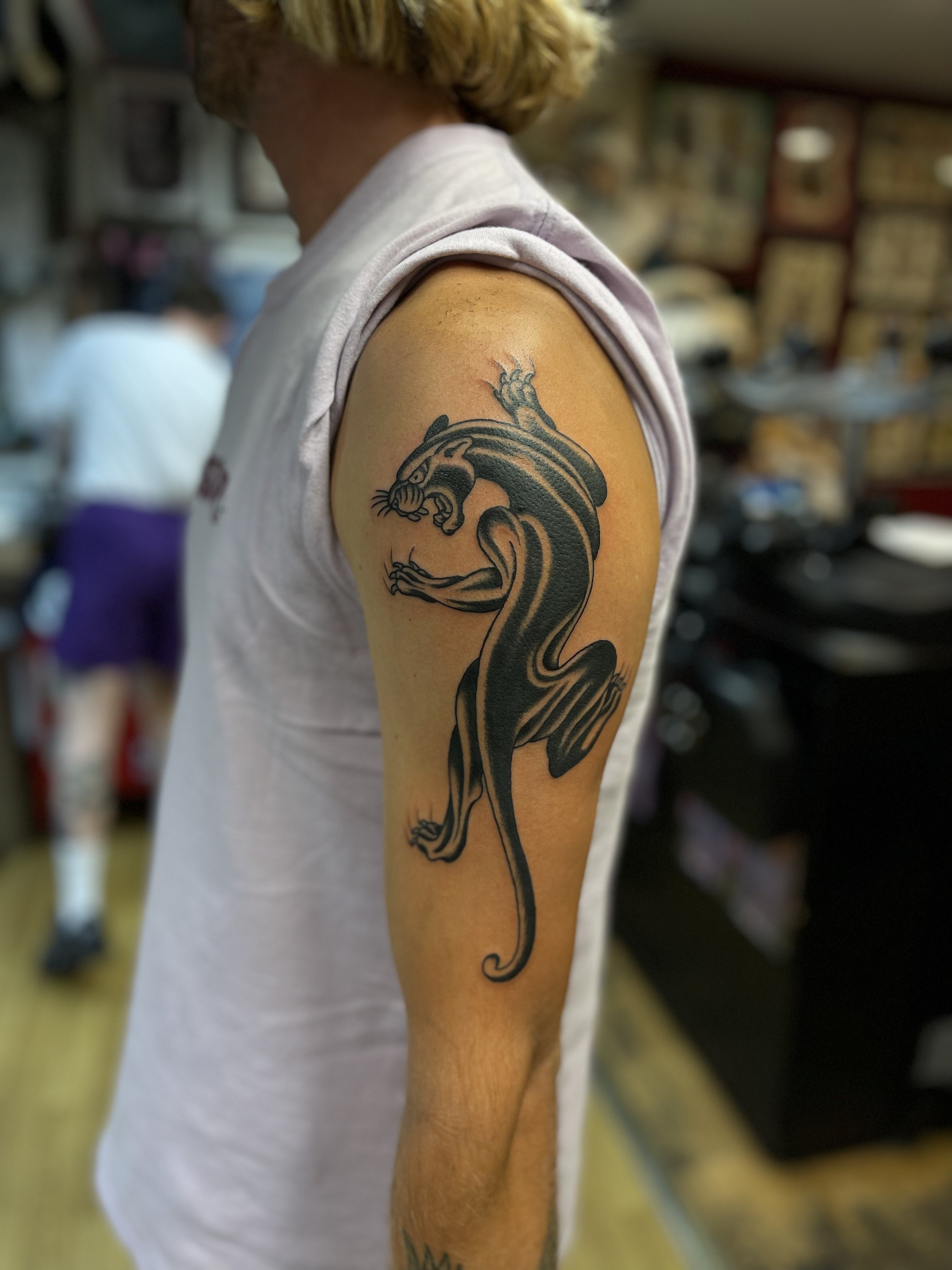 Traditional panther tattoo, done at Frith Street Tattoos, Soho, central London.