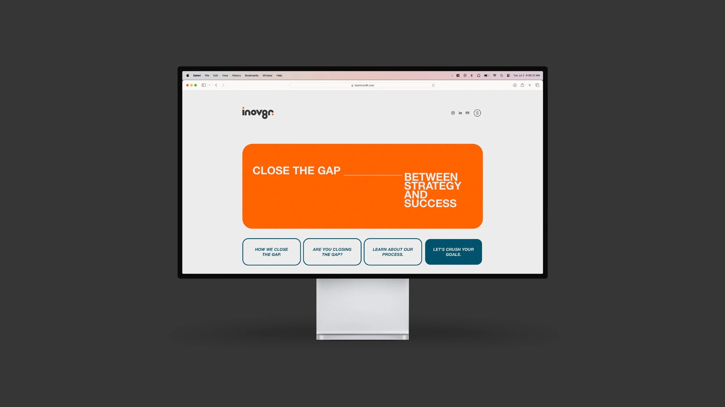 Computer monitor displaying a webpage with the title 'Close the Gap Between Strategy and Success' in an orange box, and four navigation buttons below.