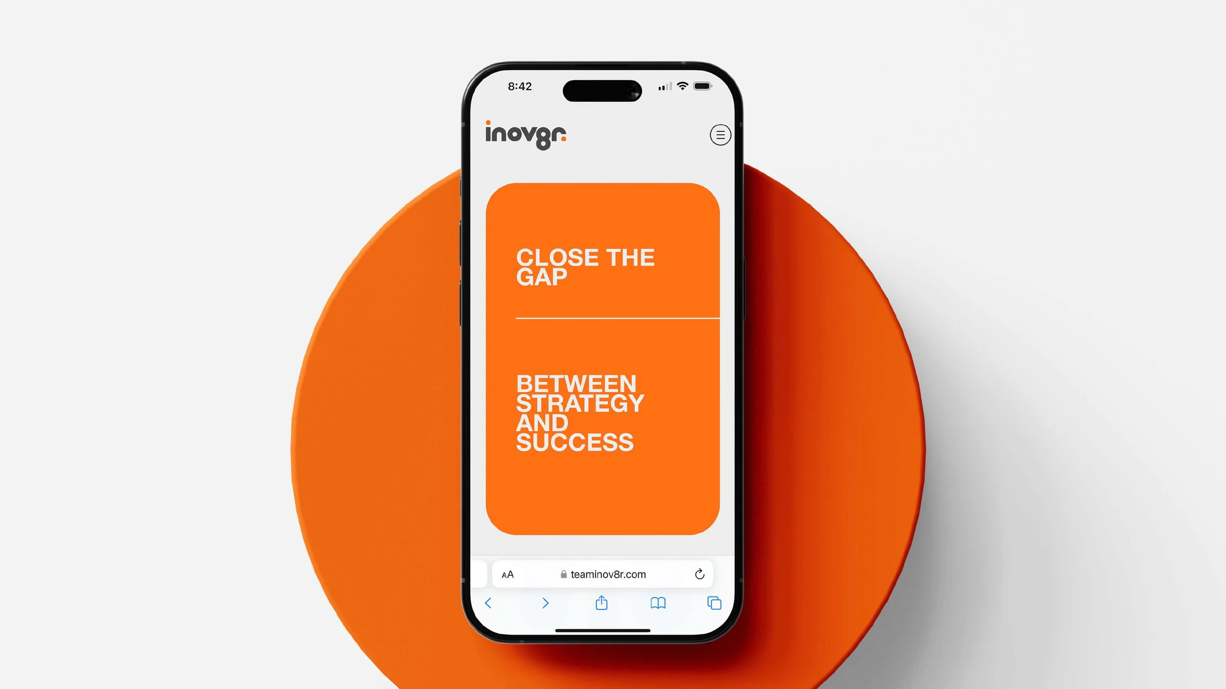 Smartphone displaying a website design with orange background and white text reading 'Close the Gap' and 'Between Strategy and Success', placed on a large orange circle against a light gray background.