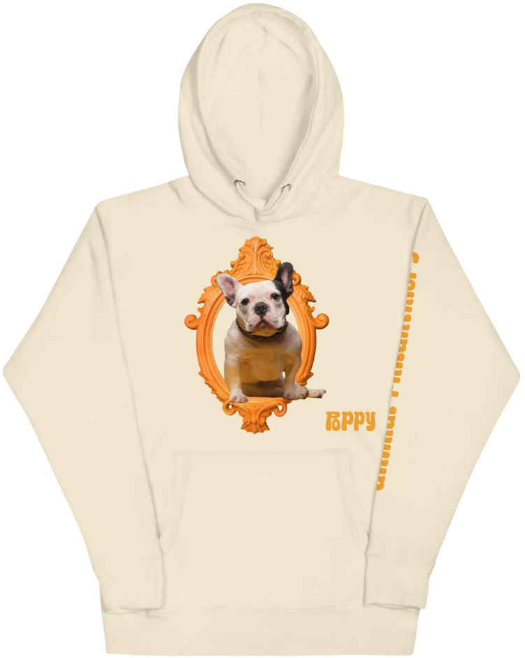 Cream-colored hoodie with an orange decorative frame around a photo of a French Bulldog puppy and the partial word 'HAPPY' written in orange on the front.