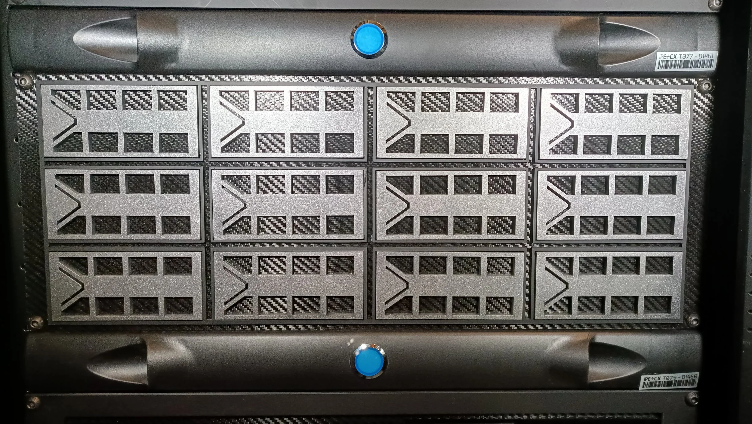 A computer server rack with ten cooling fans arranged in two rows of five, each with a black grille and silver frame, with blue circular buttons above and below the fans.