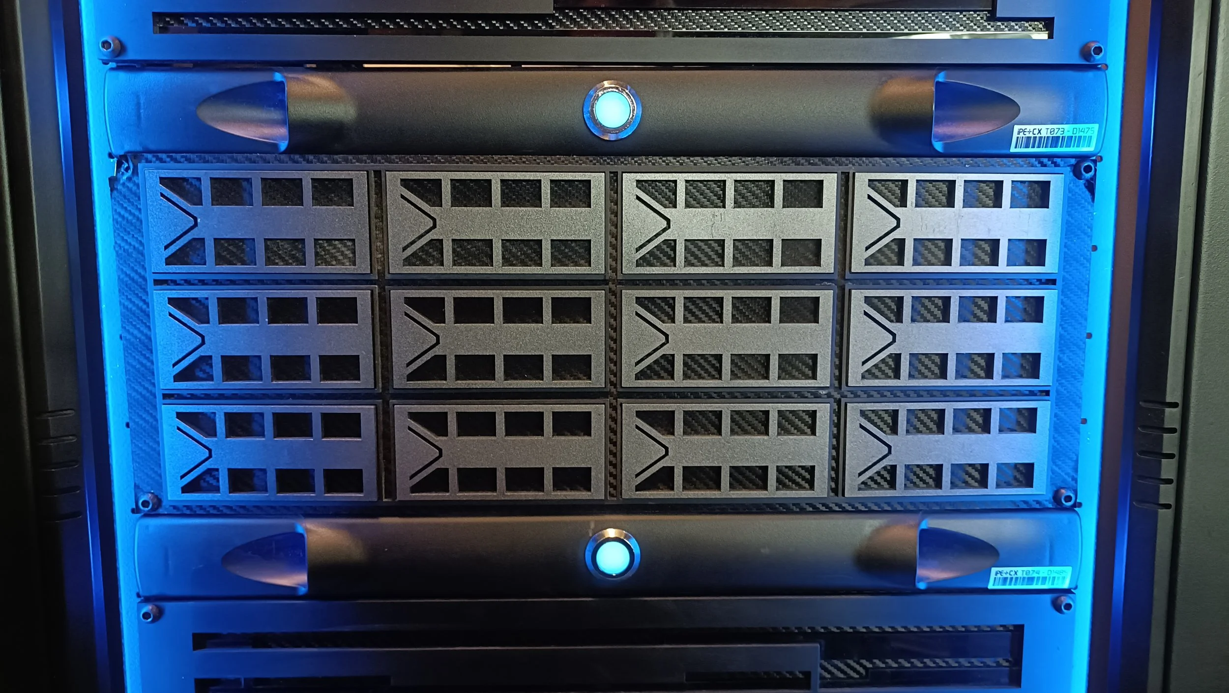 A server rack with multiple server blades, illuminated by blue LED lights.