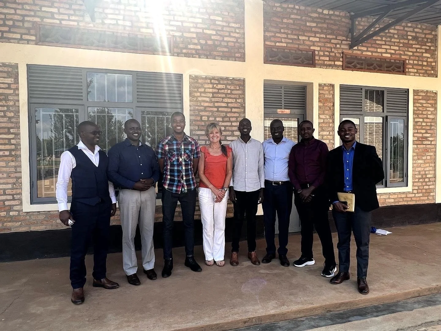 Group photo of Susan Lanz with staff and administrators of Cindi's Hope Academy