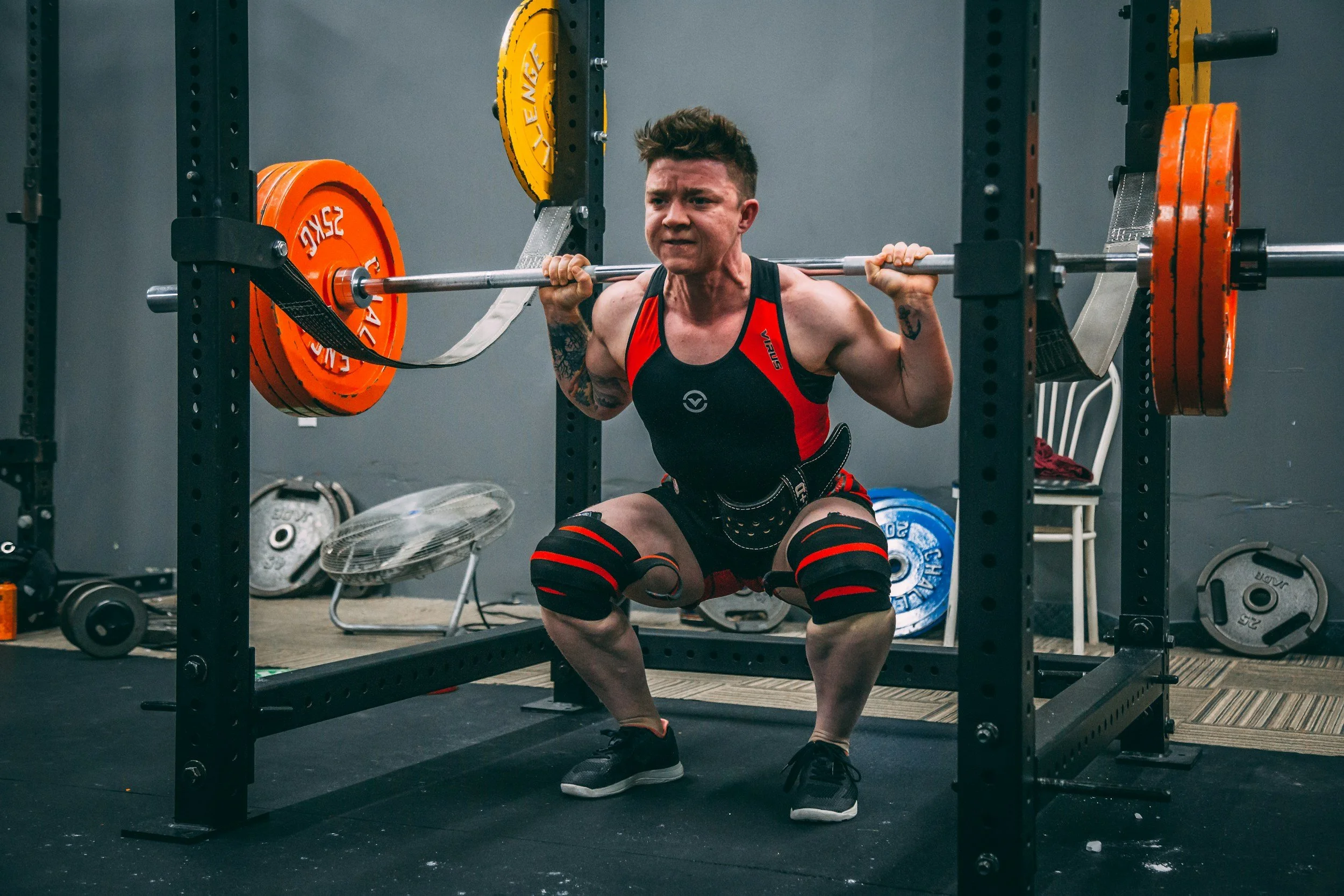 Person performing a barbell squat