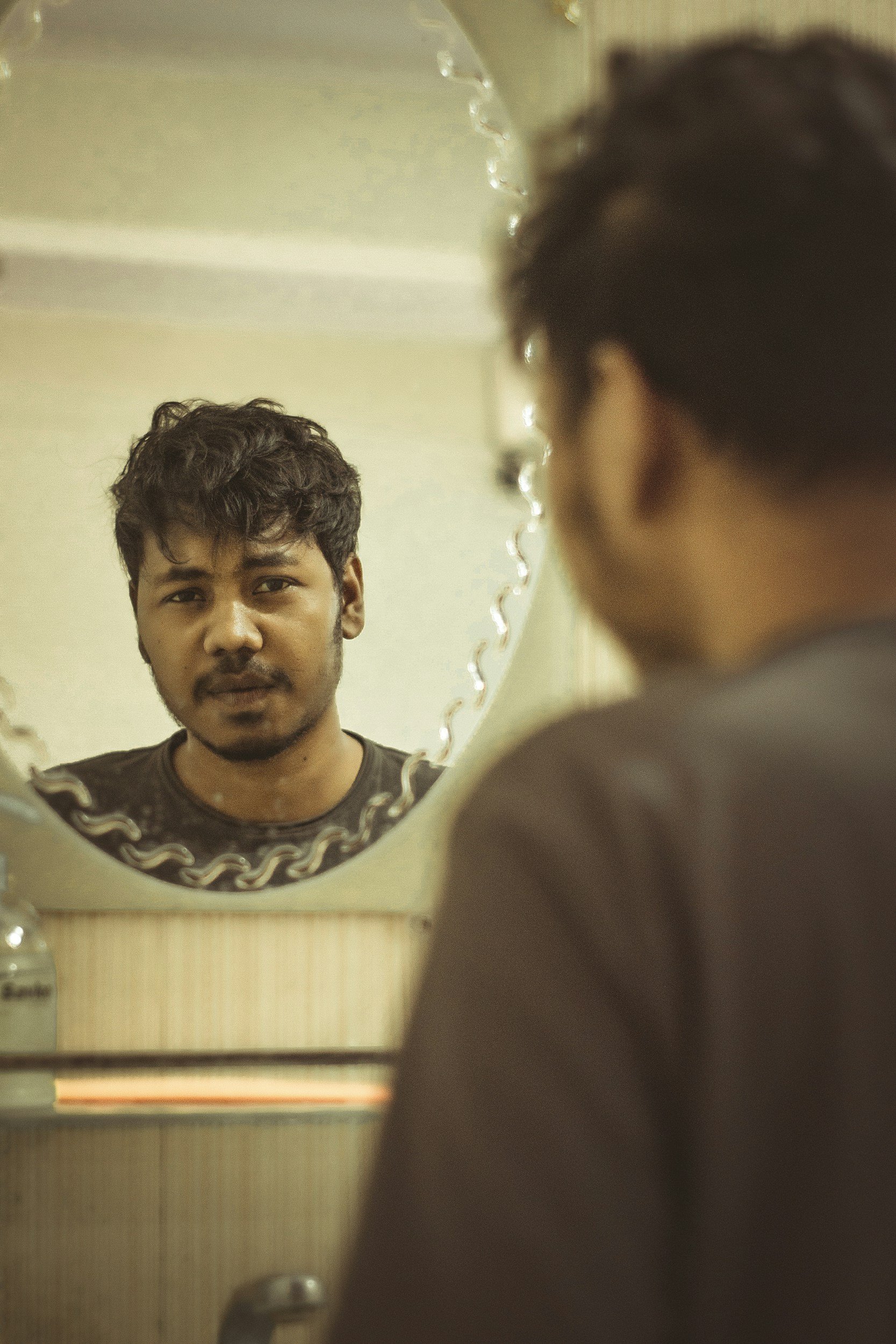 Man looking in the mirror