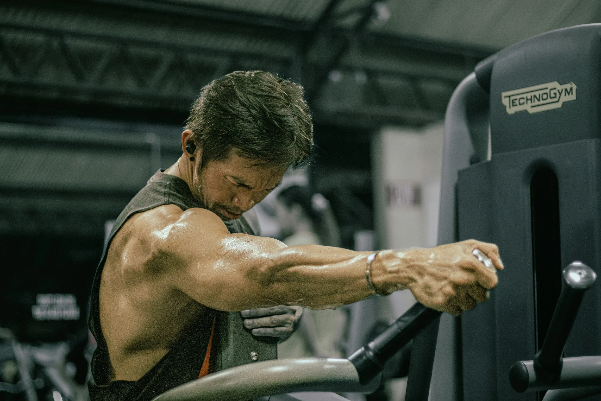 man performing seated row motion