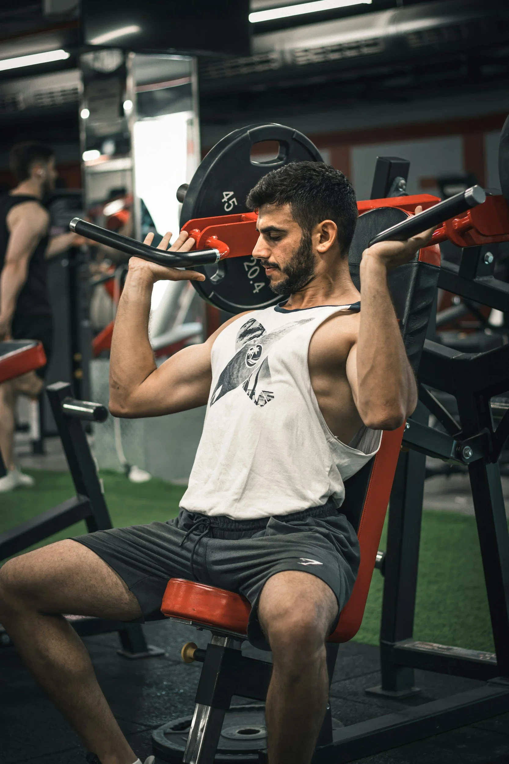 man performing shoulder press movement