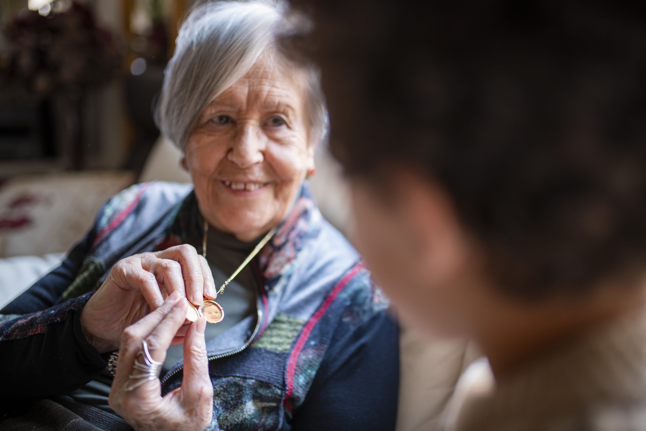 grandmother-showing-granddaughter-golden-locket-ne-2025-10-19-05-33-48-utc.jpg
