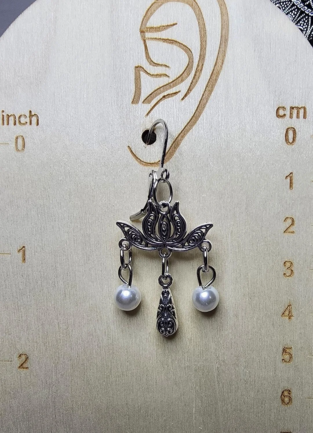 S statement silver lotus ear.jpg