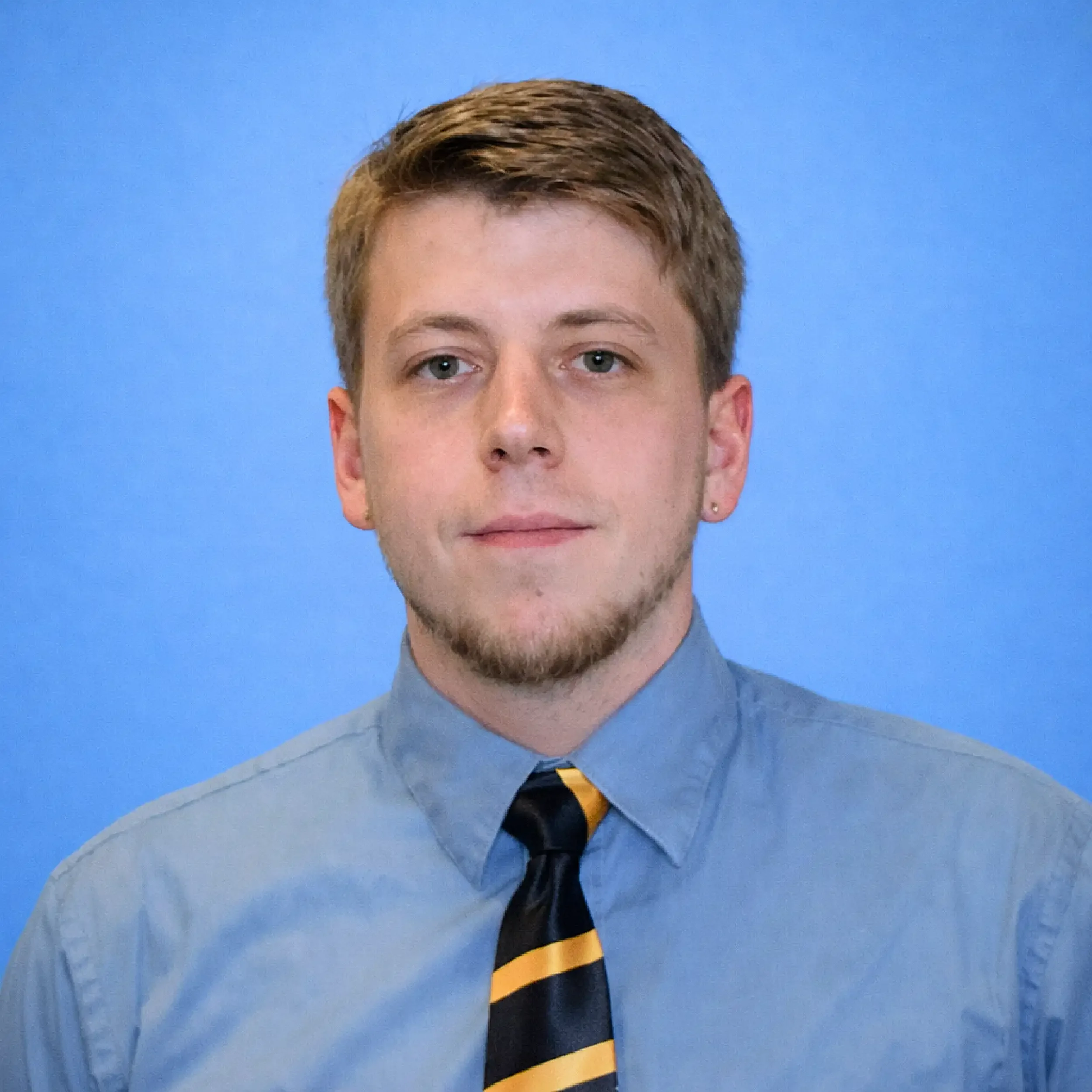 A headshot of Derek Kueker