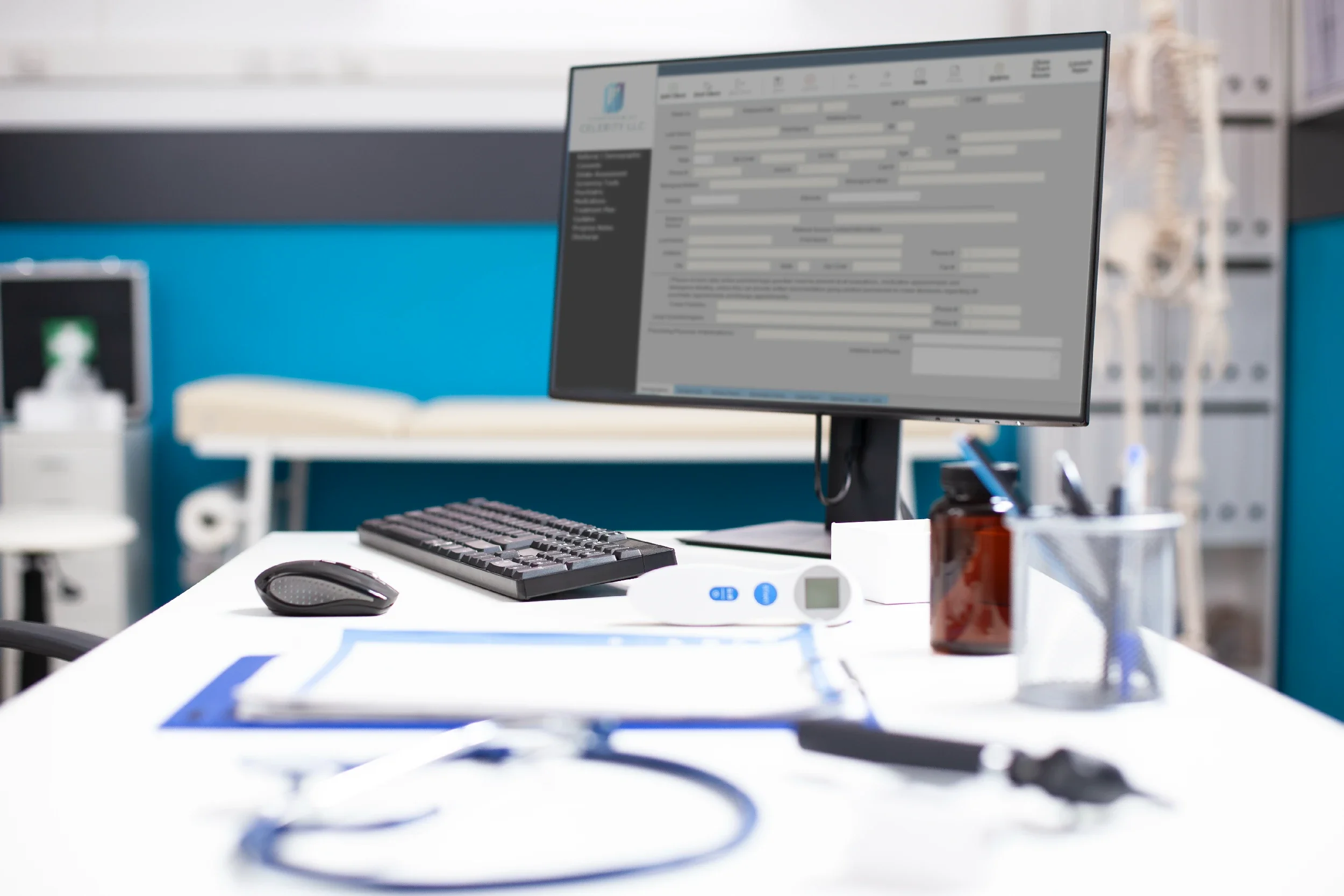 Medical office desk with computer monitor, keyboard, mouse, thermometer, and medical supplies in the background.