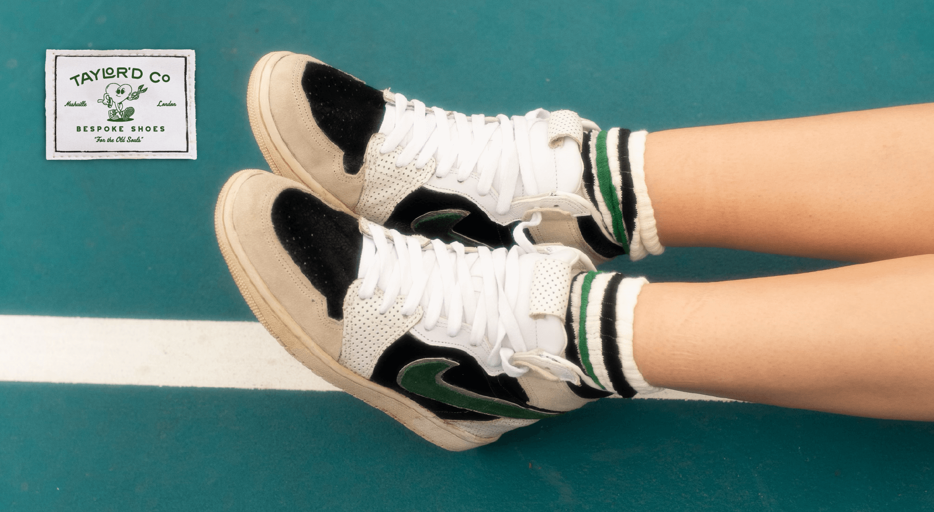 a person wearing a pair of custom shoes made by Taylor'd Co.