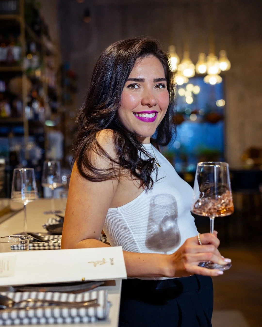 Meet Maria, our Sommelier at Krasi&mdash;the warm welcome you didn&rsquo;t know you needed into the world of wine. With roots in Latin America and a background in music, she brings rhythm, soul, and a whole lot of heart to every pour. A singer at hea