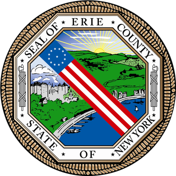 Seal of Erie County, New York, featuring a shield with the American flag, a cityscape, green hills, and a sunrise.