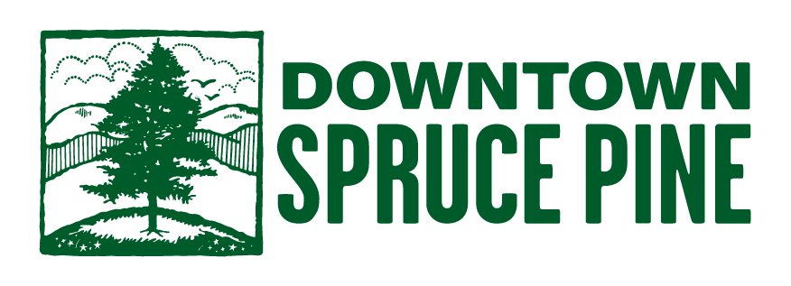 Green logo with a pine tree inside a square and the text "Downtown Spruce Pine" to the right.