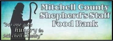 Sign for Mitchell County Shepherd's Staff Food Bank with an illustration of a shepherd holding a staff, and the quote, 'No one goes hungry in Mitchell County.'