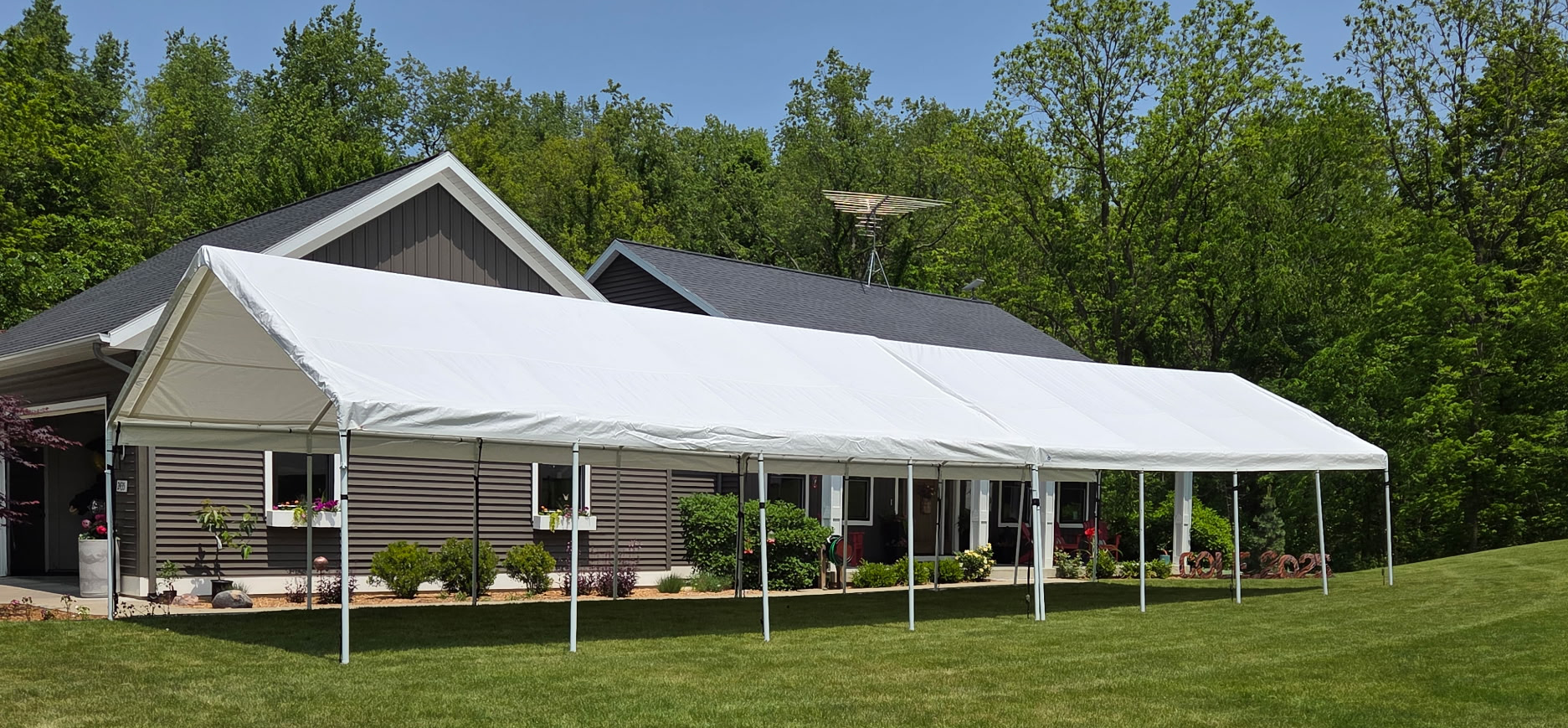 Two 30x20 Tents in front yard