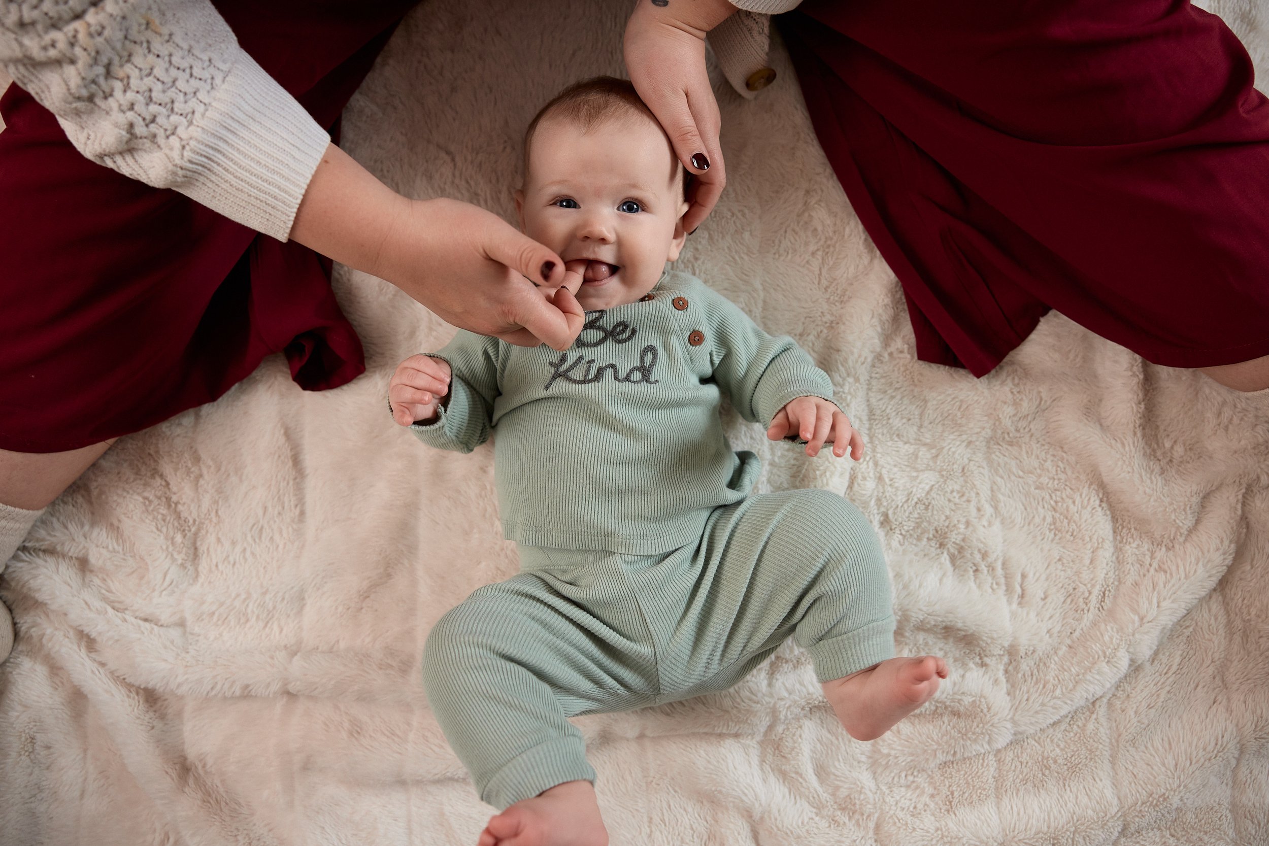A Baby with a tongue tie is getting infant massage therapy to help provide painful latch solutions.